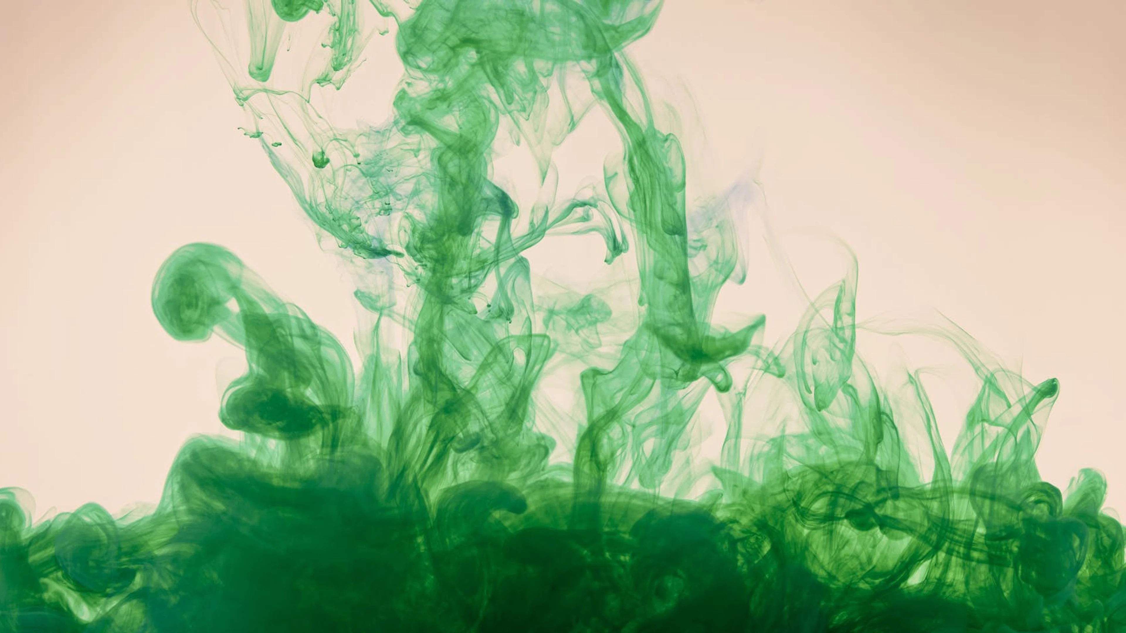 Captivating abstract image of green ink swirling elegantly in water motion. - free 4K Ultra HD abstract wallpaper for desktop