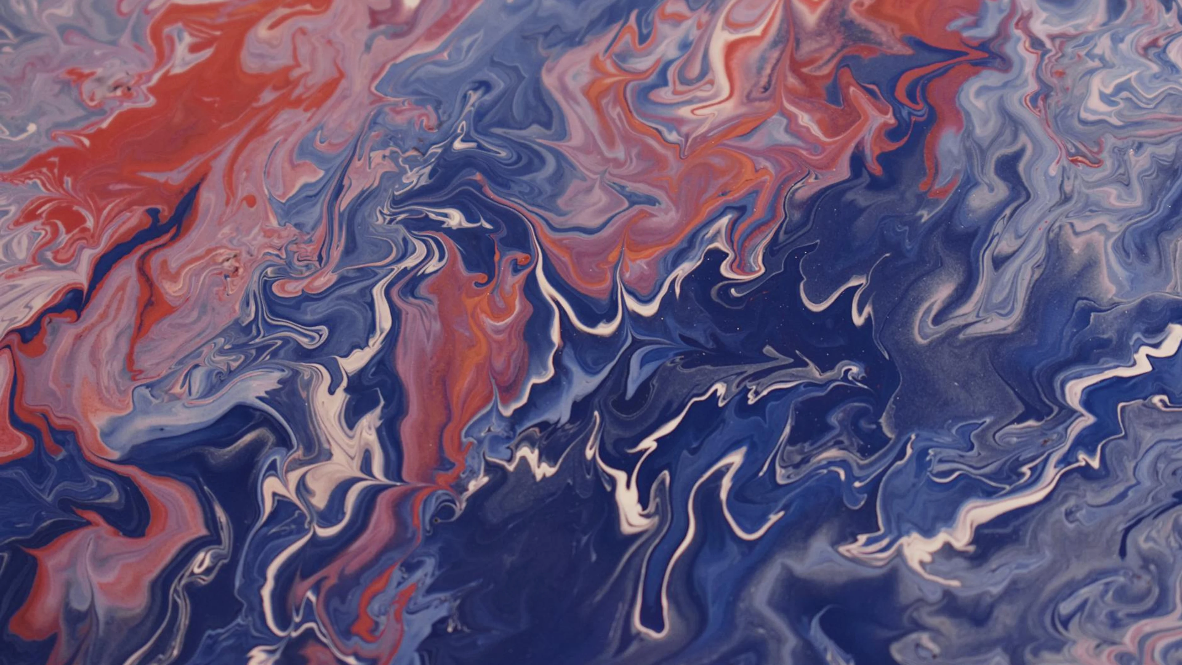 Dynamic swirls of blue and red acrylic paint create a vibrant abstract design. - free 4K Ultra HD abstract wallpaper for desktop