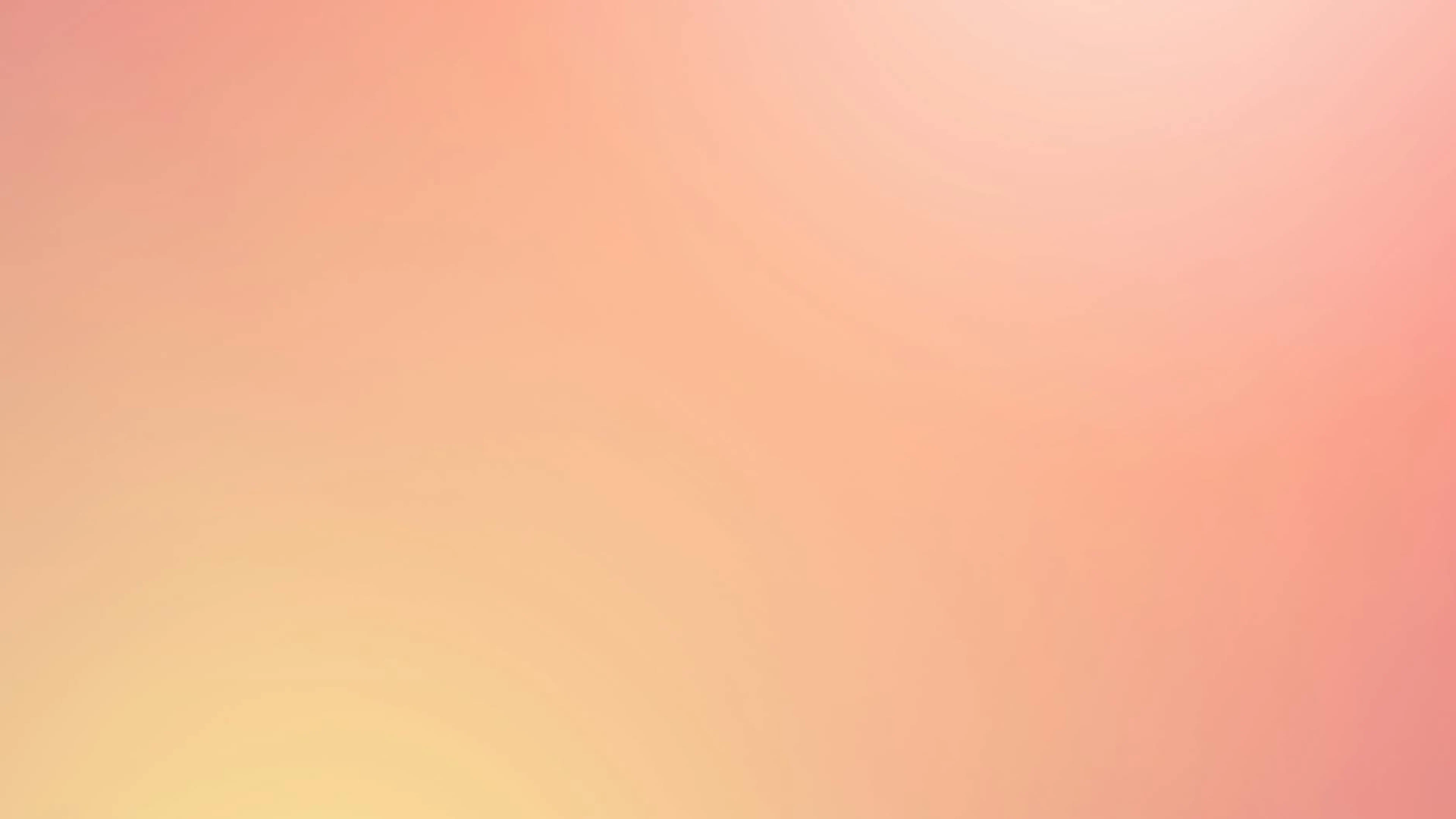 Soft abstract gradient background in pink and yellow hues - free 4K Ultra HD abstract wallpaper for desktop