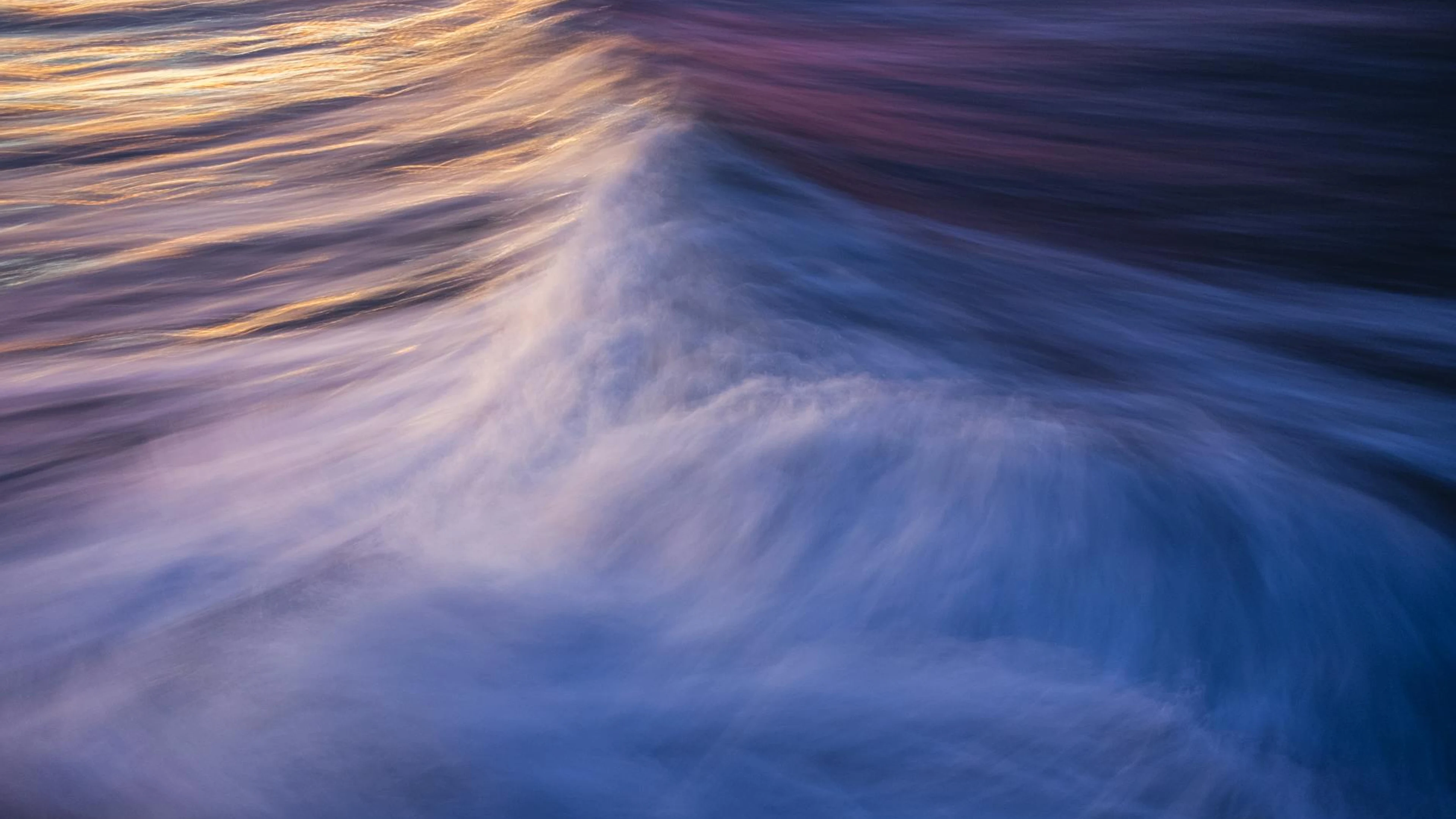 Captivating abstract view of ocean waves with colorful sunset reflections. - free 4K Ultra HD aesthetic wallpaper for desktop