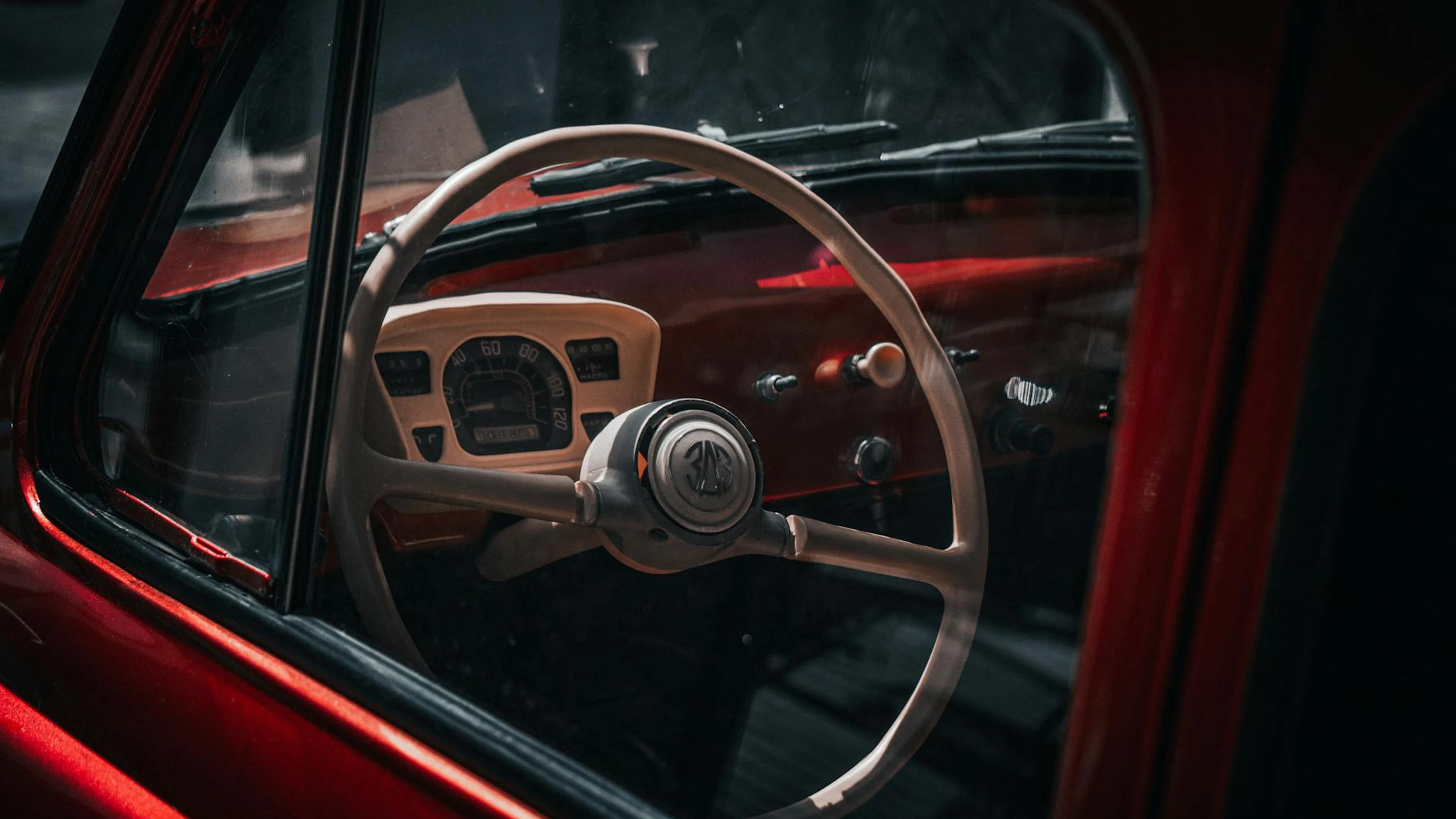 Close-up of a vintage car's steering wheel and dashboard, emphasizing a classic - free 4K Ultra HD aesthetic wallpaper for desktop