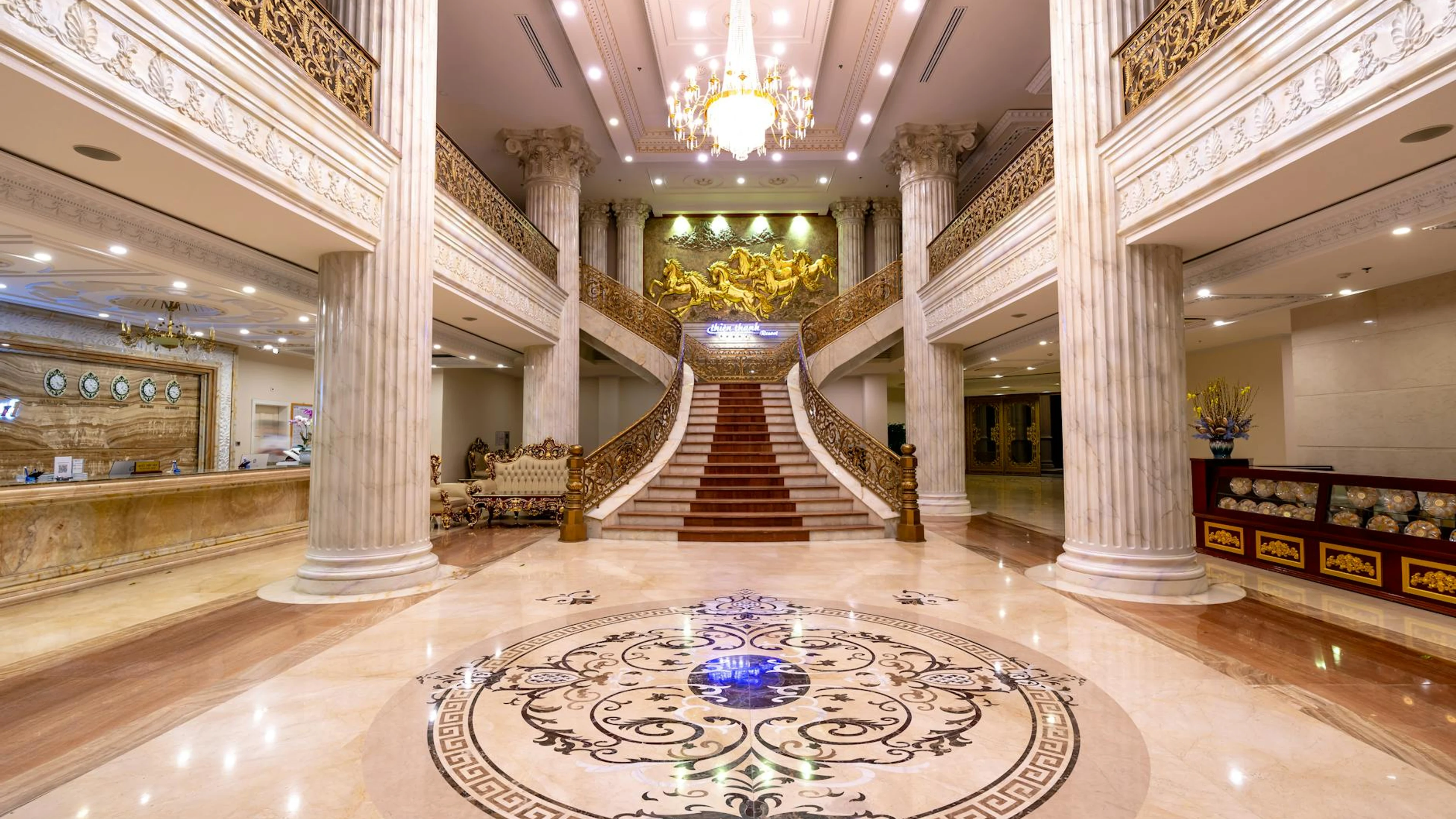 Elegant hotel foyer featuring a grand staircase, marble floors, and a dazzling c - free 4K Ultra HD architecture wallpaper for desktop
