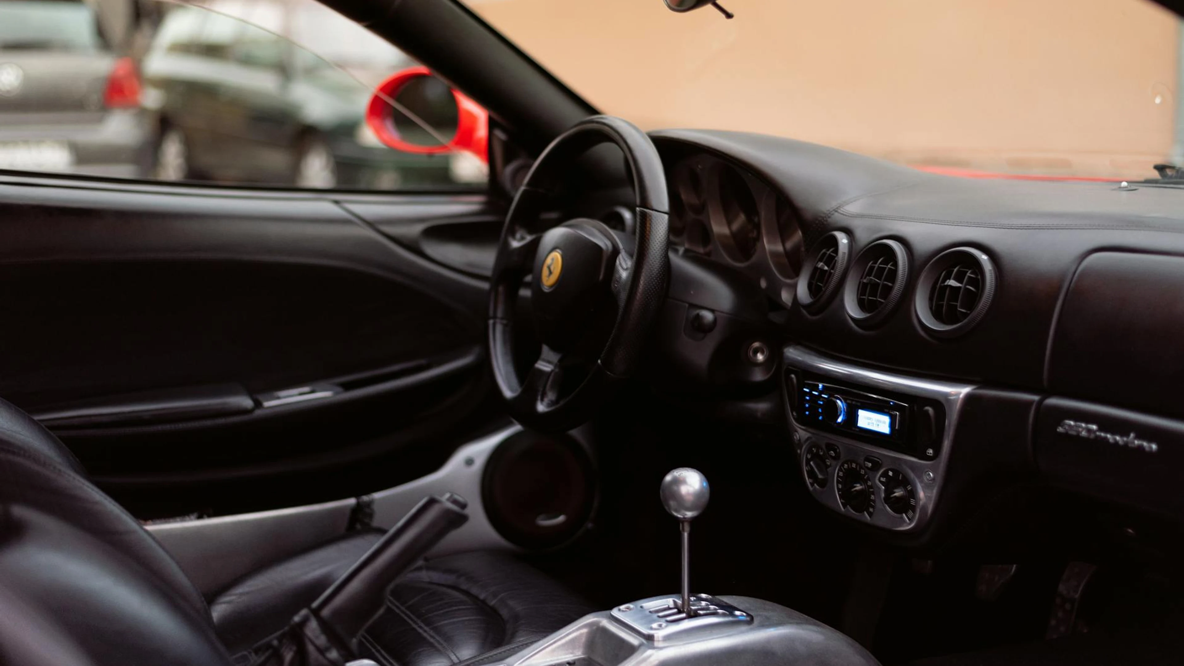 Explore the sleek interior of a luxury sports car featuring leather seats and ad - free 4K Ultra HD architecture wallpaper for desktop