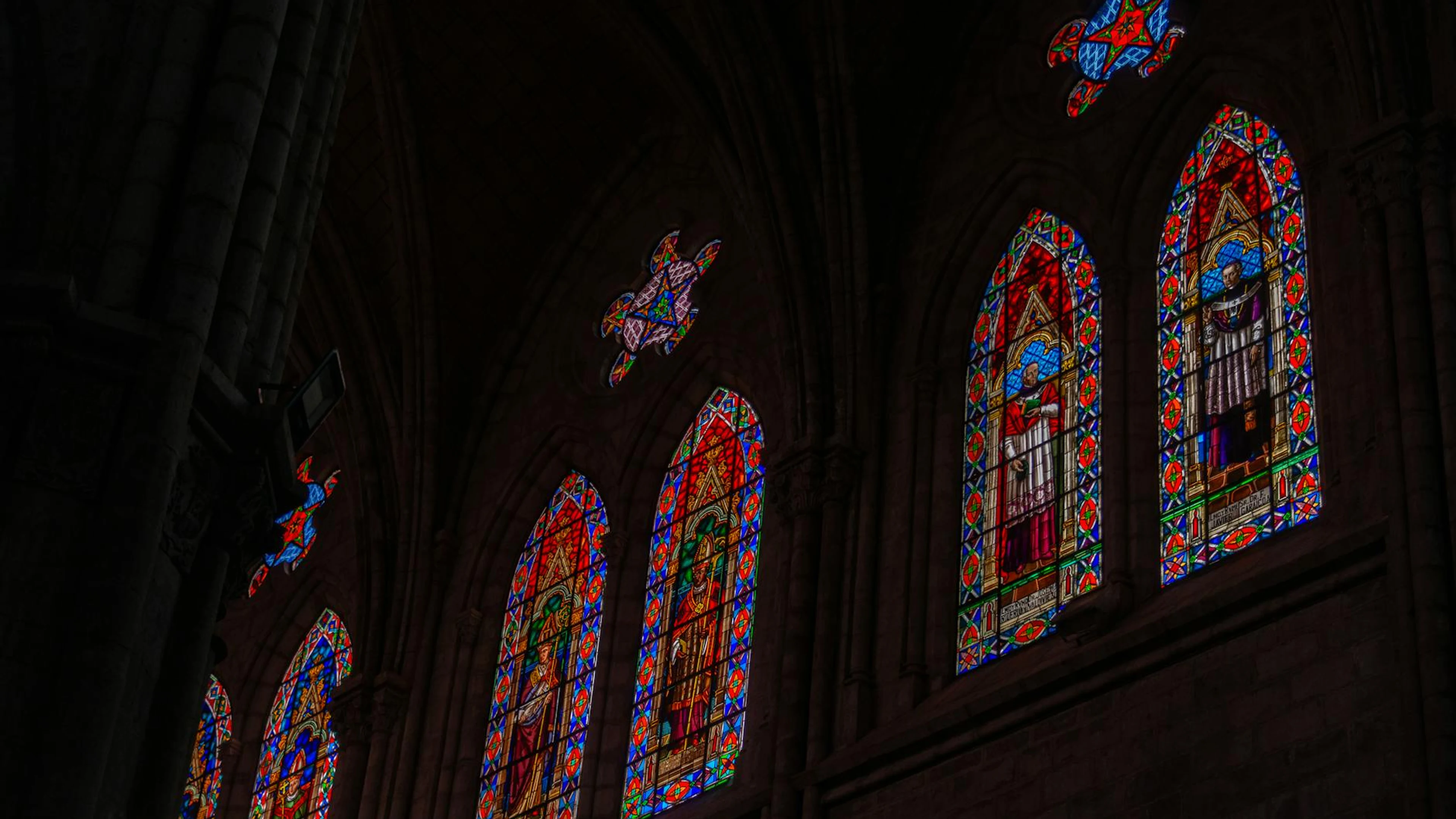 Intricate stained glass windows inside a Gothic cathedral, depicting religious f - free 4K Ultra HD architecture wallpaper for desktop
