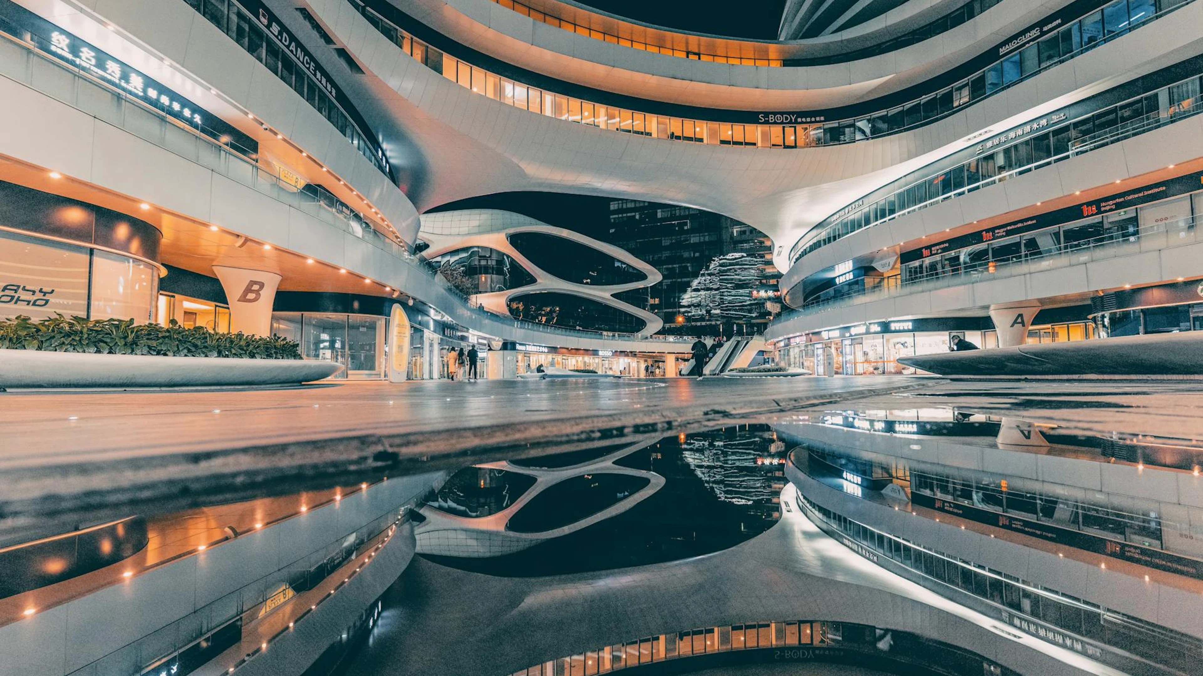 Night view of the futuristic Galaxy SOHO building in Beijing, China, showcasing - free 4K Ultra HD architecture wallpaper for desktop