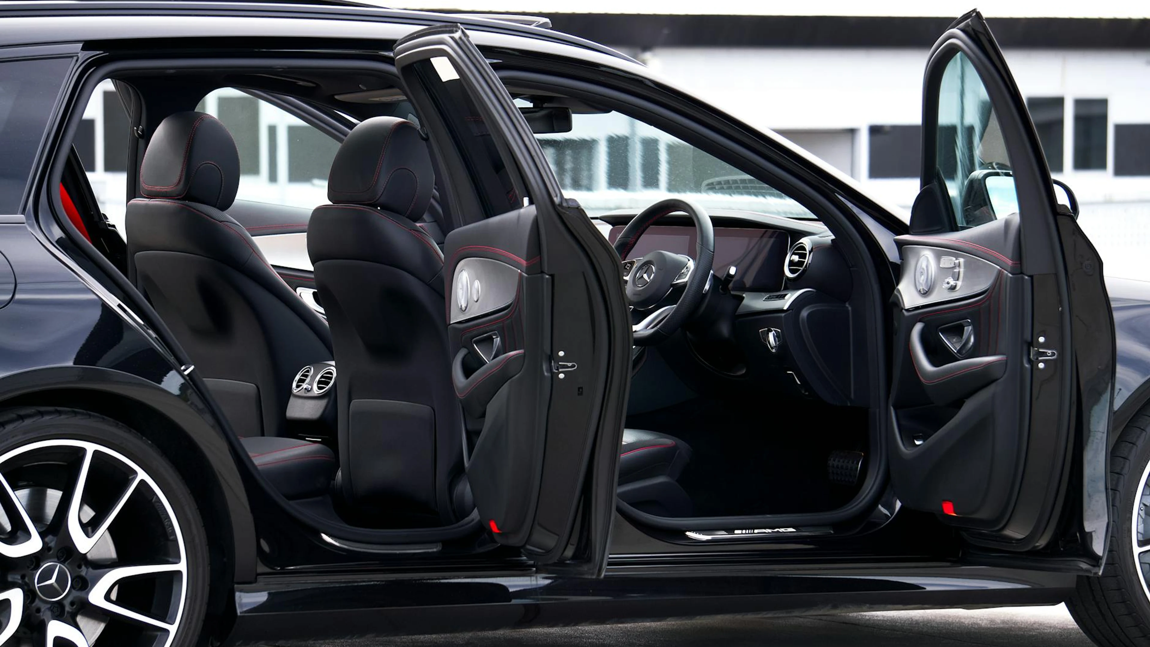 Sleek and elegant interior of a luxury car with open doors showcasing detailed l - free 4K Ultra HD architecture wallpaper for desktop