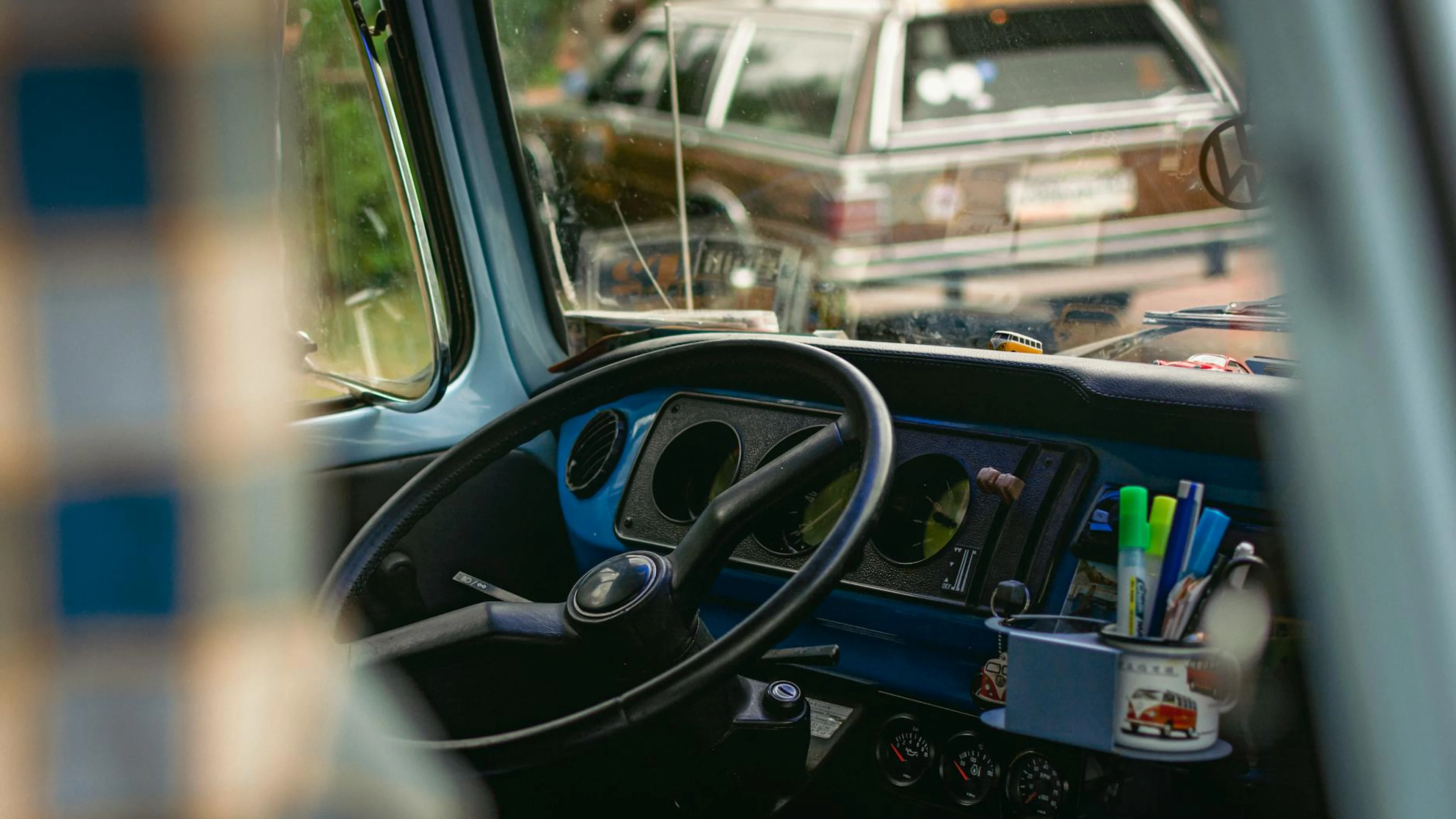Interior view of a vintage car featuring a classic dashboard, steering wheel, an - free 4K Ultra HD cars wallpaper for desktop