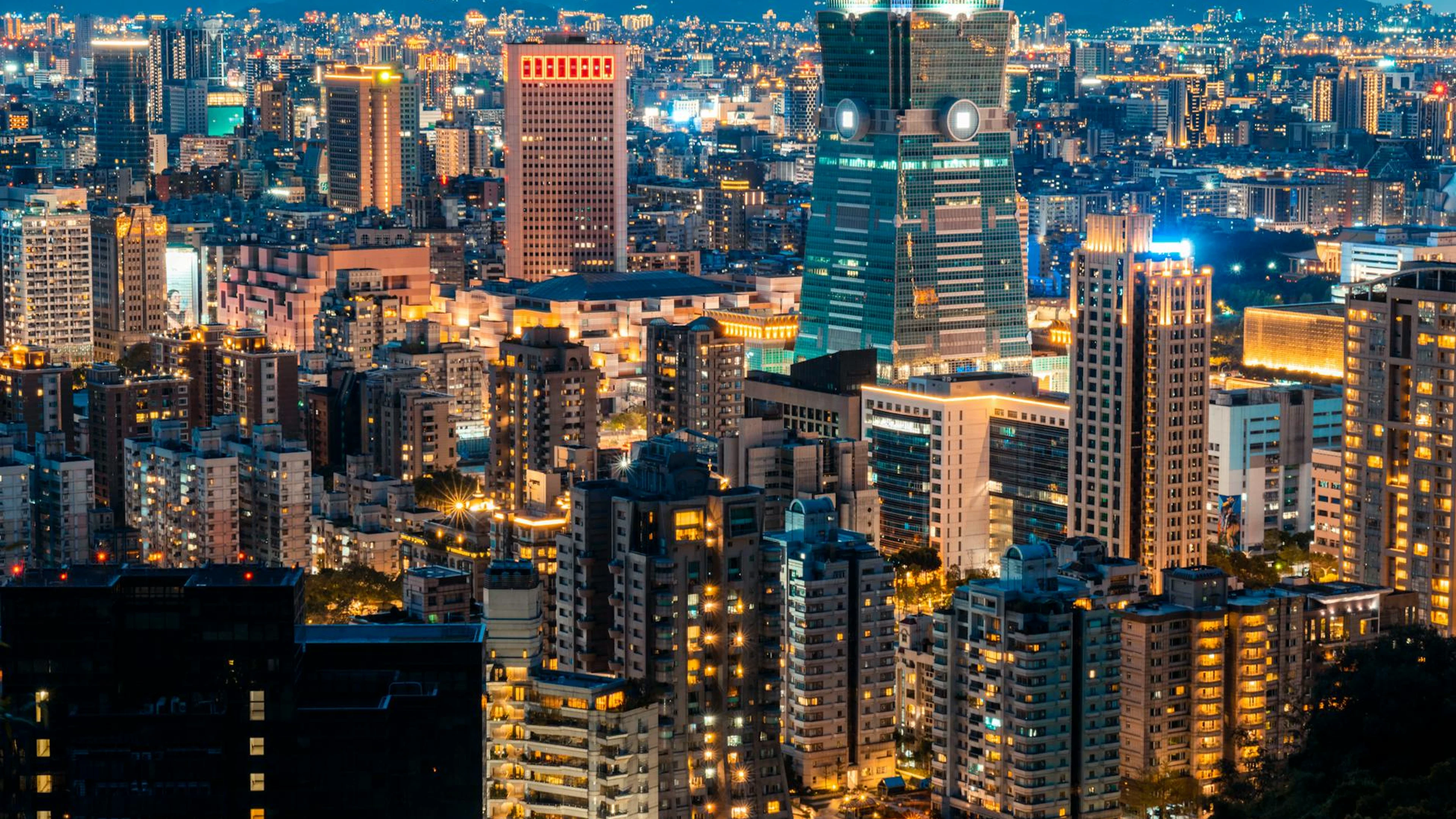 A striking view of the illuminated Taipei skyline featuring the iconic Taipei 10 - free 4K Ultra HD city wallpaper for desktop