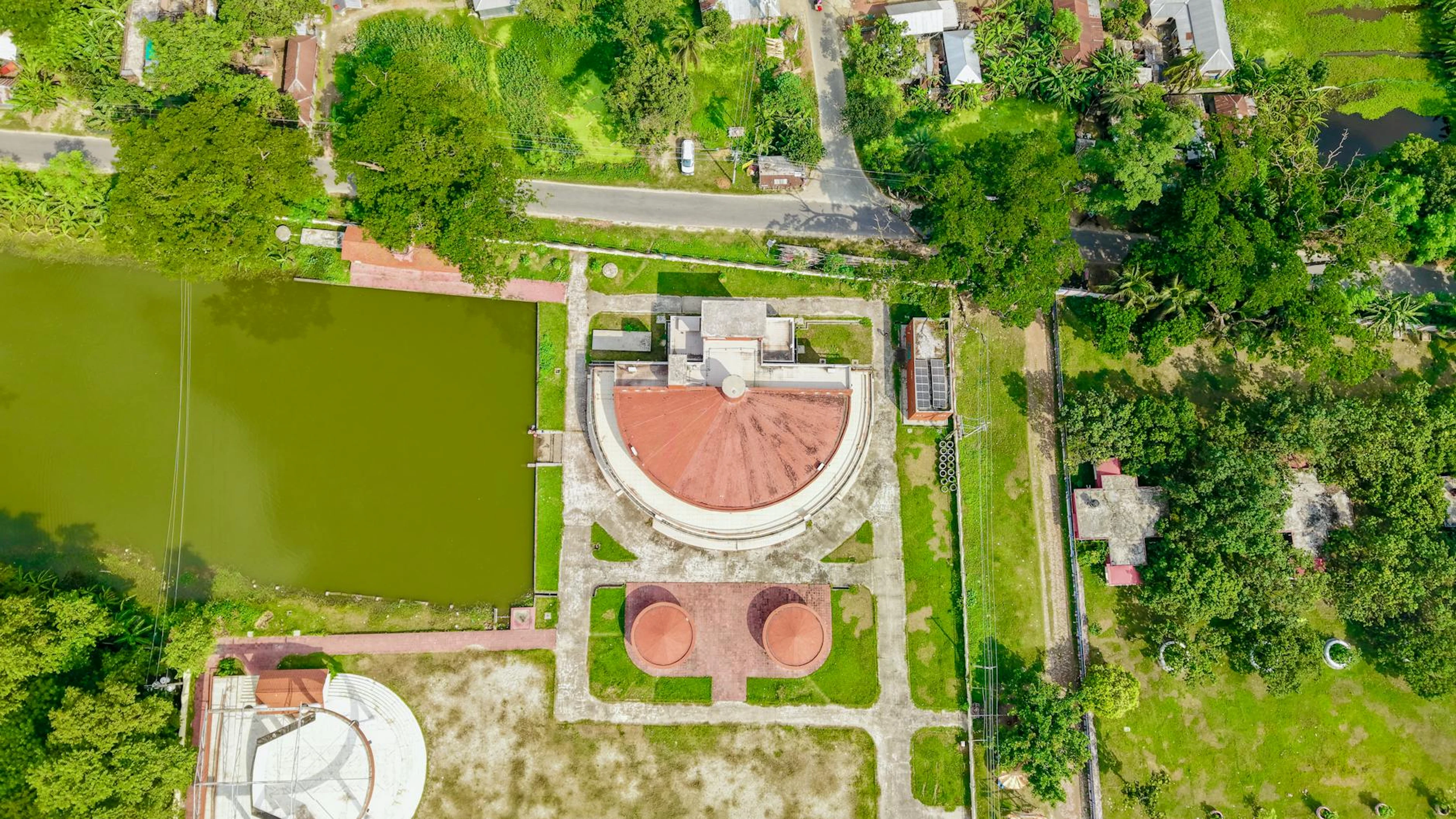 Drone capture of village landscape showcasing architecture and greenery. - free 4K Ultra HD city wallpaper for desktop