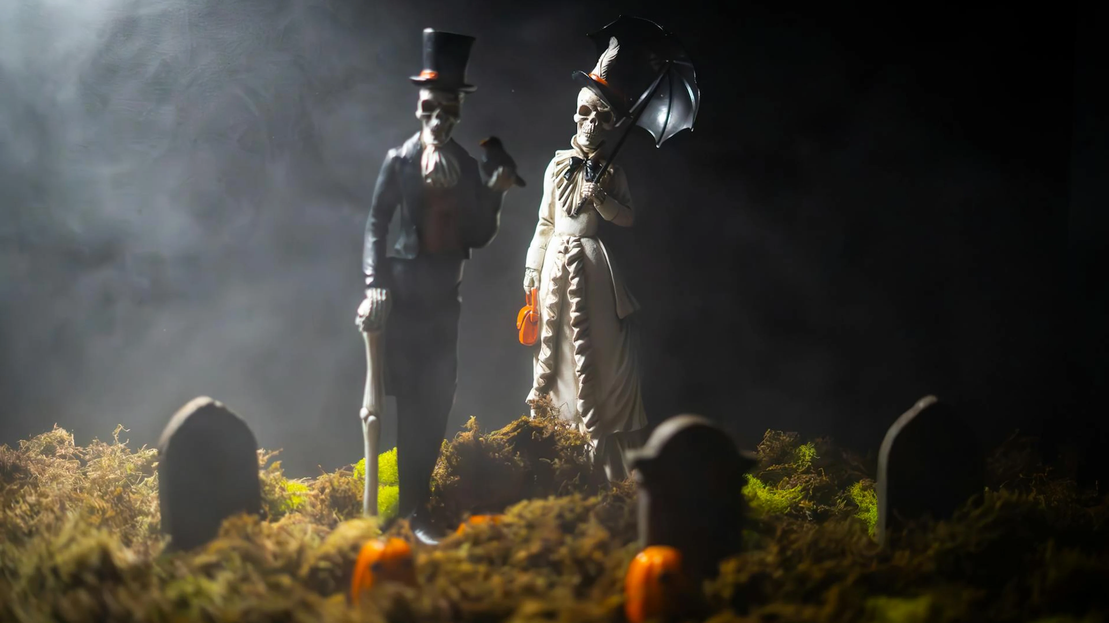 Mysterious skeleton figures in Victorian attire amidst gravestones, perfect for - free 4K Ultra HD dark wallpaper for desktop