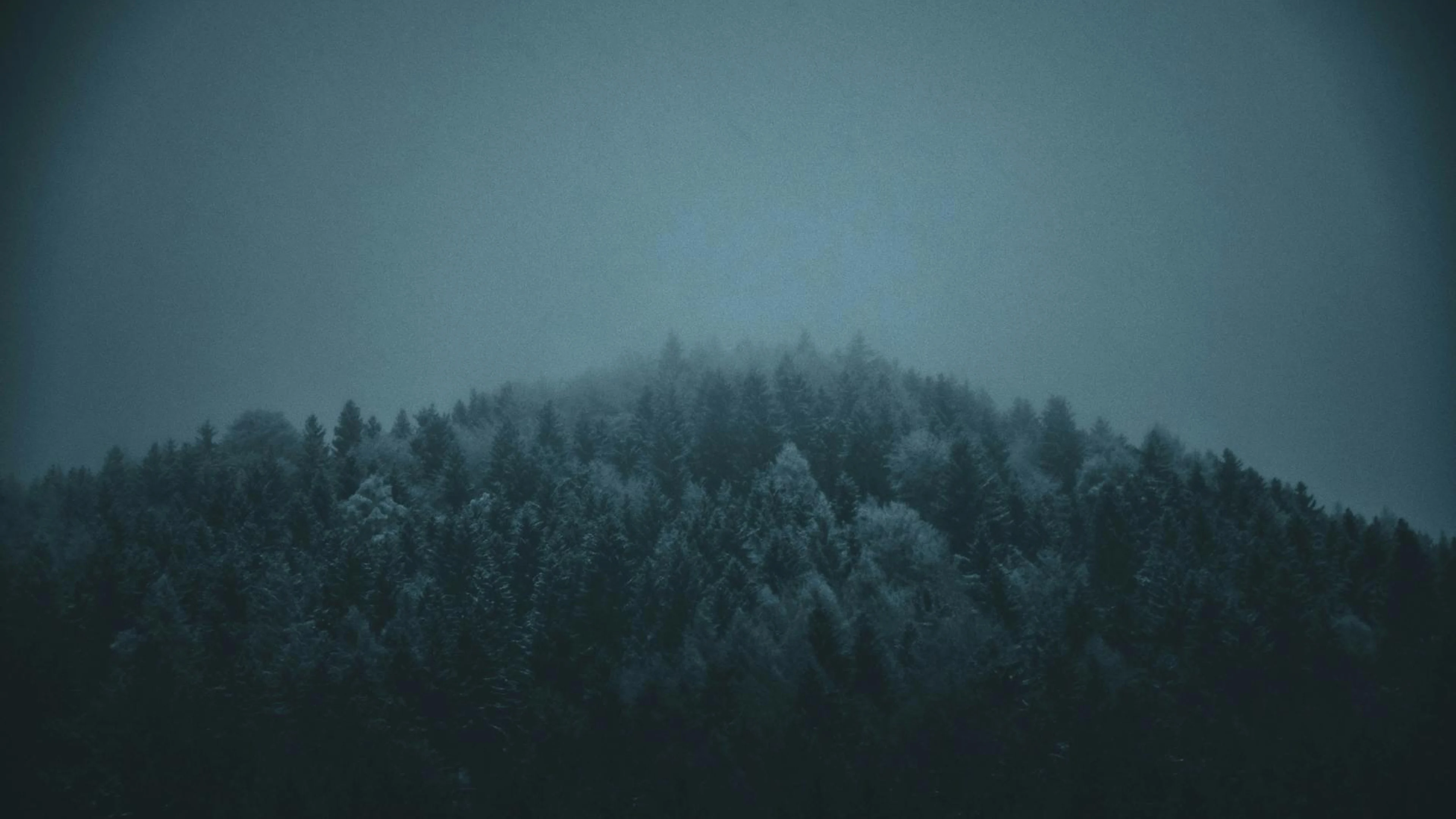 A serene foggy winter scene of snow-covered forest in Jenbach, Austria. - free 4K Ultra HD fantasy wallpaper for desktop