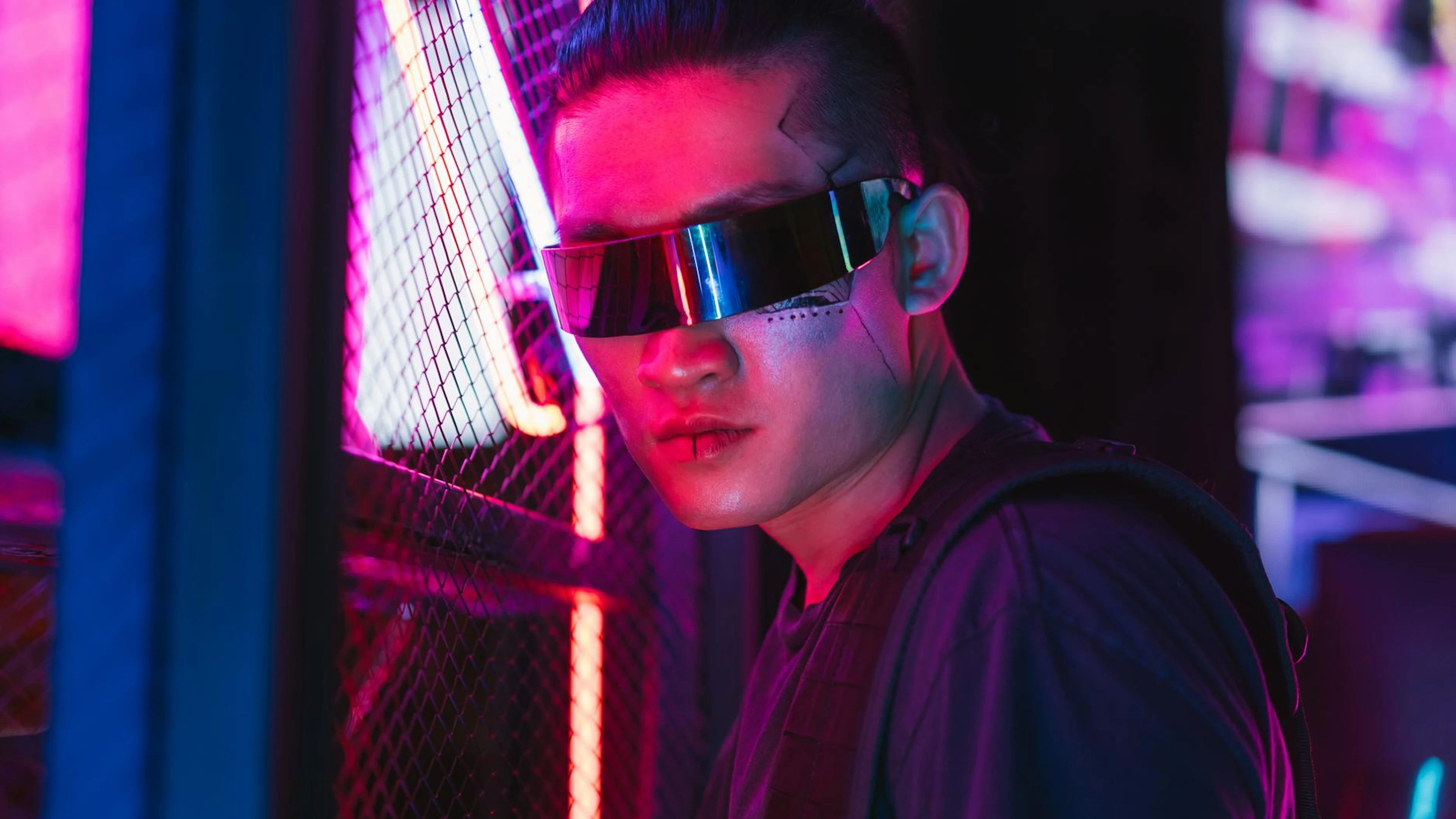 A futuristic man in cyberpunk style with neon lights, showcasing cool fashion an - free 4K Ultra HD gaming wallpaper for desktop