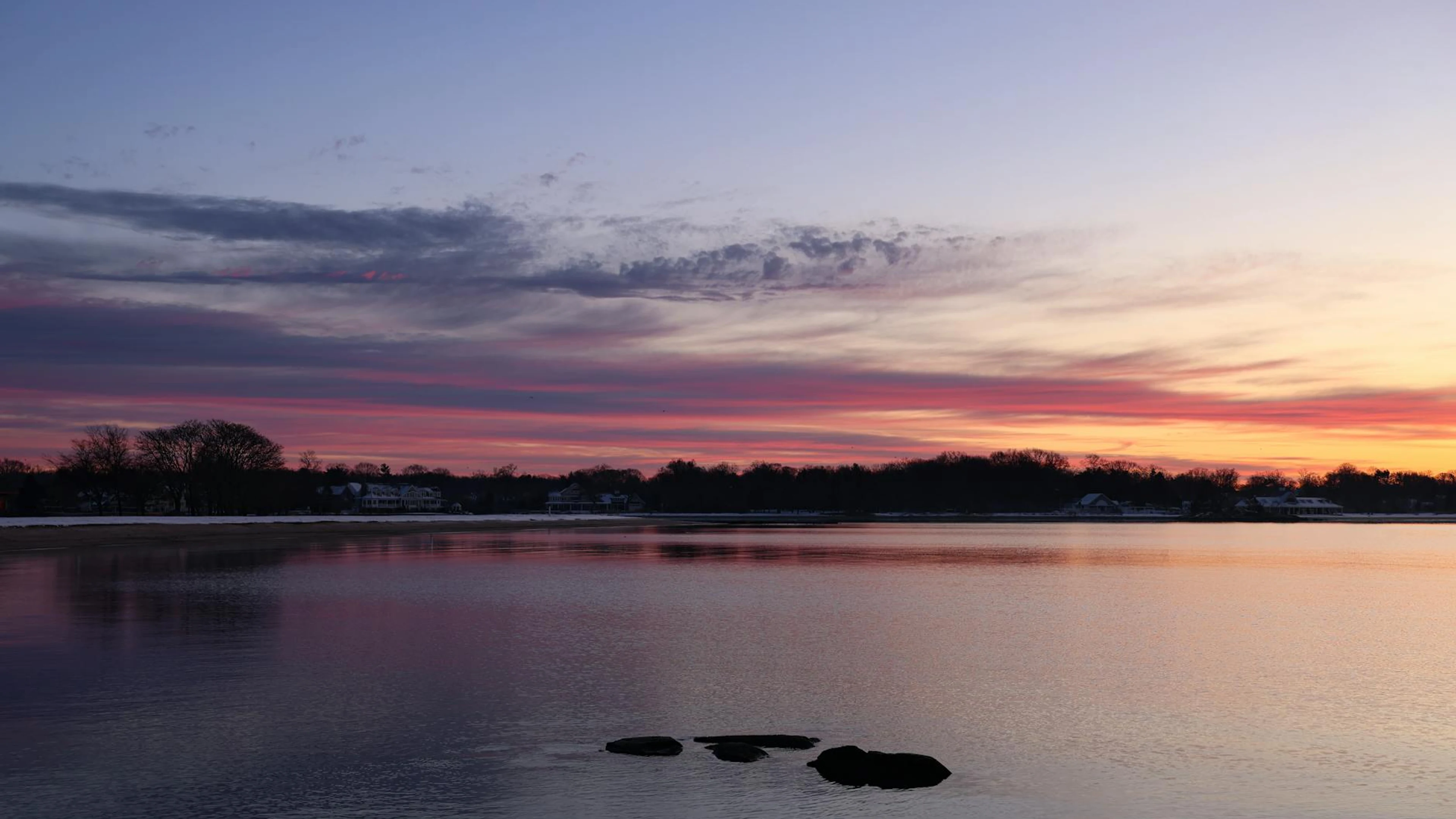 A tranquil lake reflecting a stunning sunset sky, perfect for serene nature scen - free 4K Ultra HD lake wallpaper for desktop