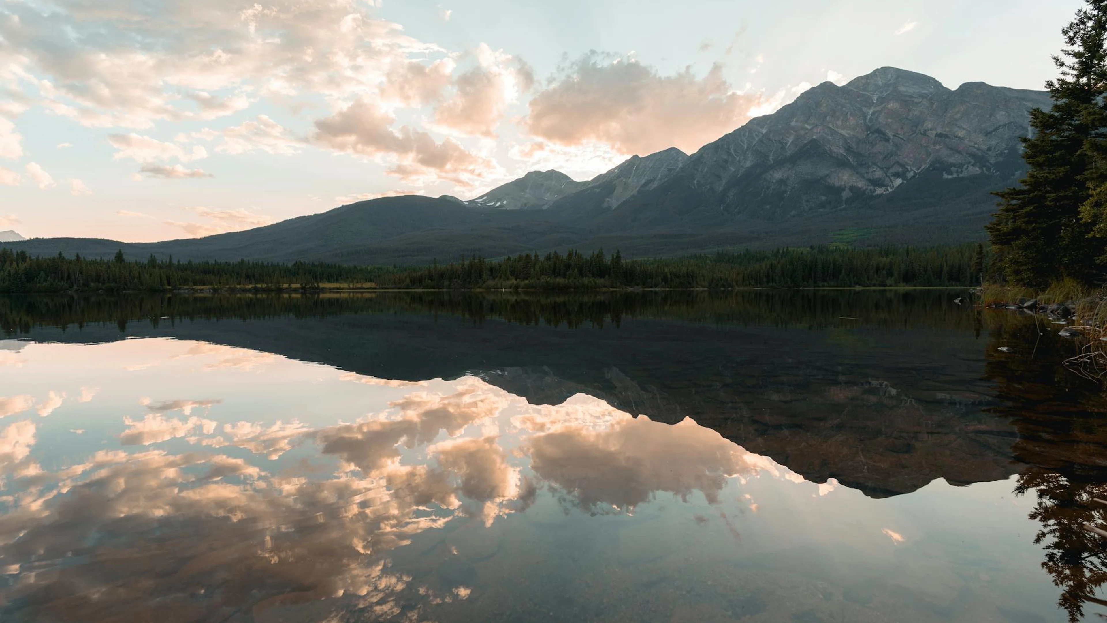 Breathtaking sunset over a serene lake in Jasper National Park, Canada, reflecti - free 4K Ultra HD lake wallpaper for desktop