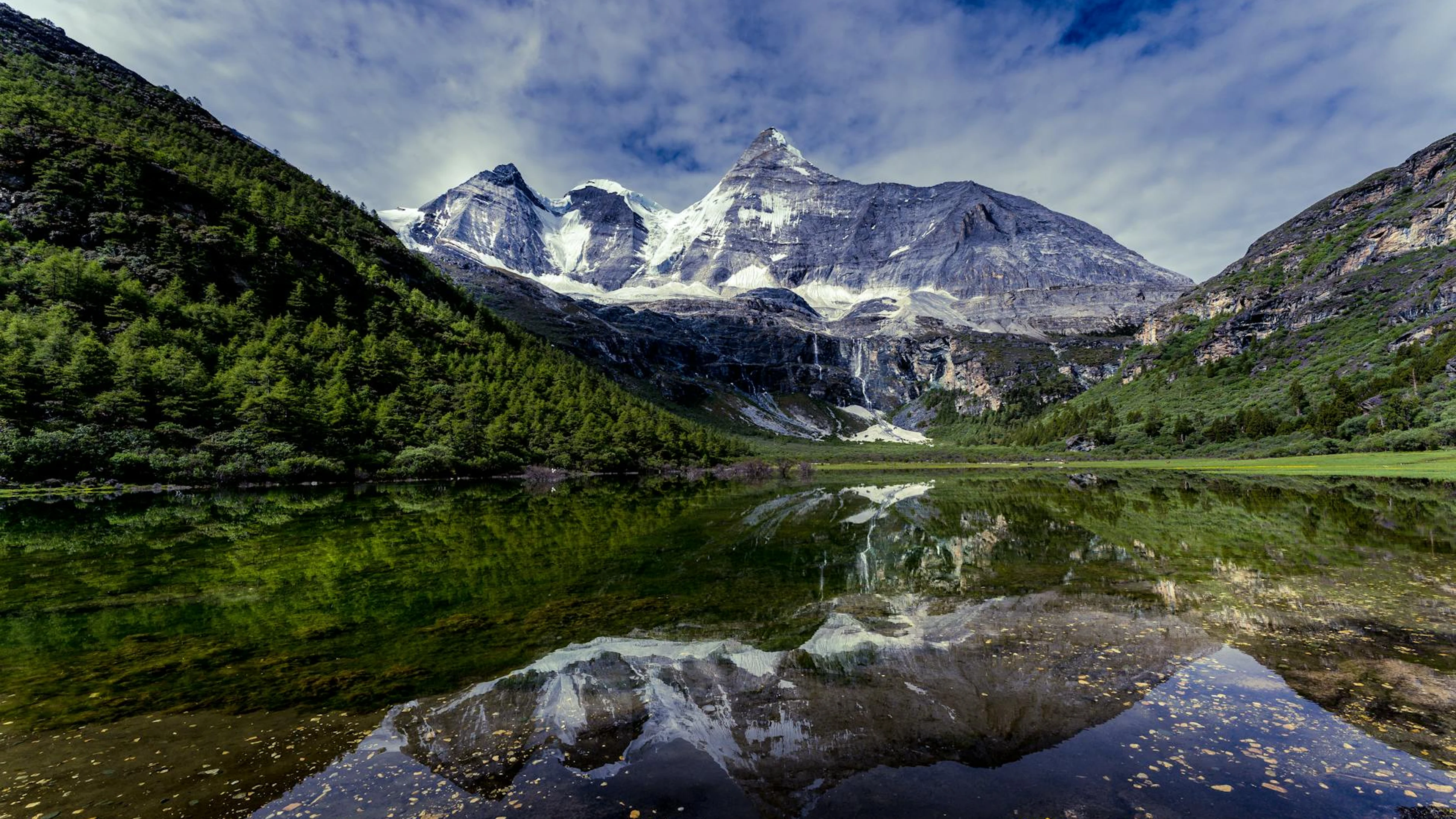 Stunning snow-capped mountains reflected in a tranquil lake surrounded by lush g - free 4K Ultra HD lake wallpaper for desktop