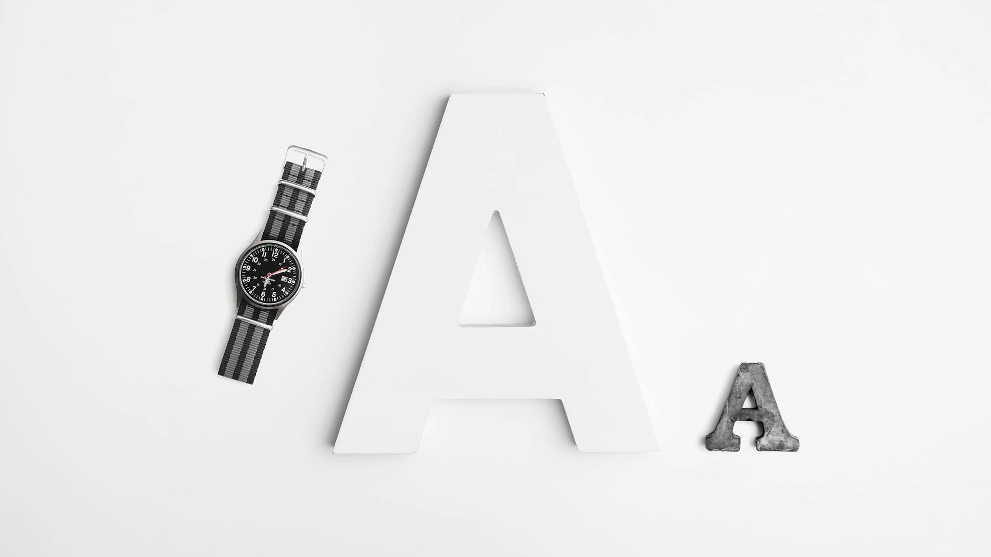 Minimalist layout featuring typography with a sleek watch and bold letter A desi - free 4K Ultra HD minimal wallpaper for desktop