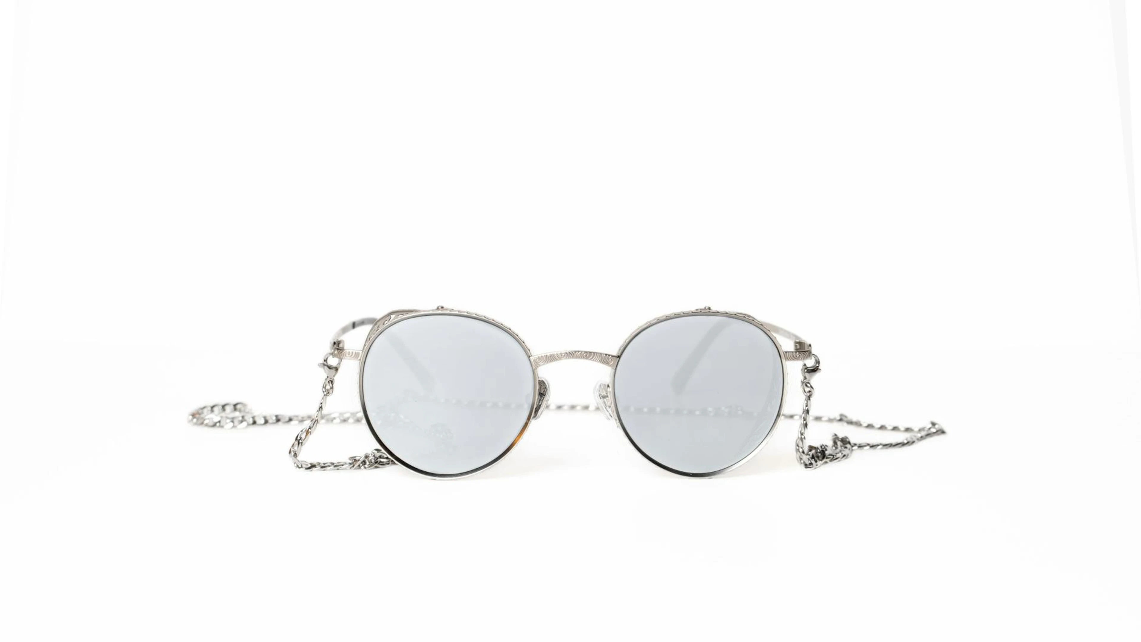 Round sunglasses with silver chain, perfect for a minimalist fashion look on a w - free 4K Ultra HD minimal wallpaper for desktop