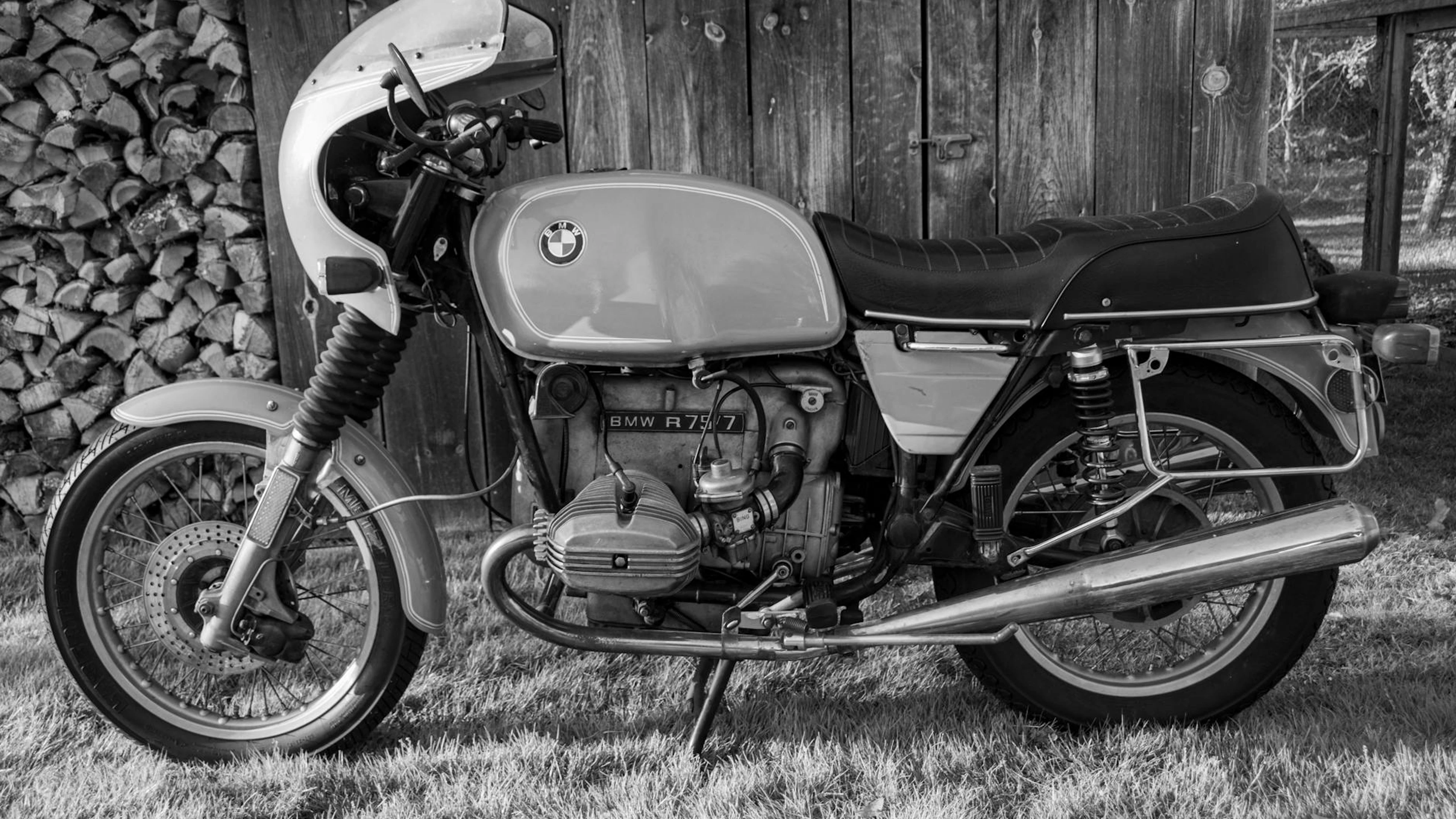 Classic BMW motorcycle in a monochromatic style against wooden background. - free 4K Ultra HD motorcycle wallpaper for desktop