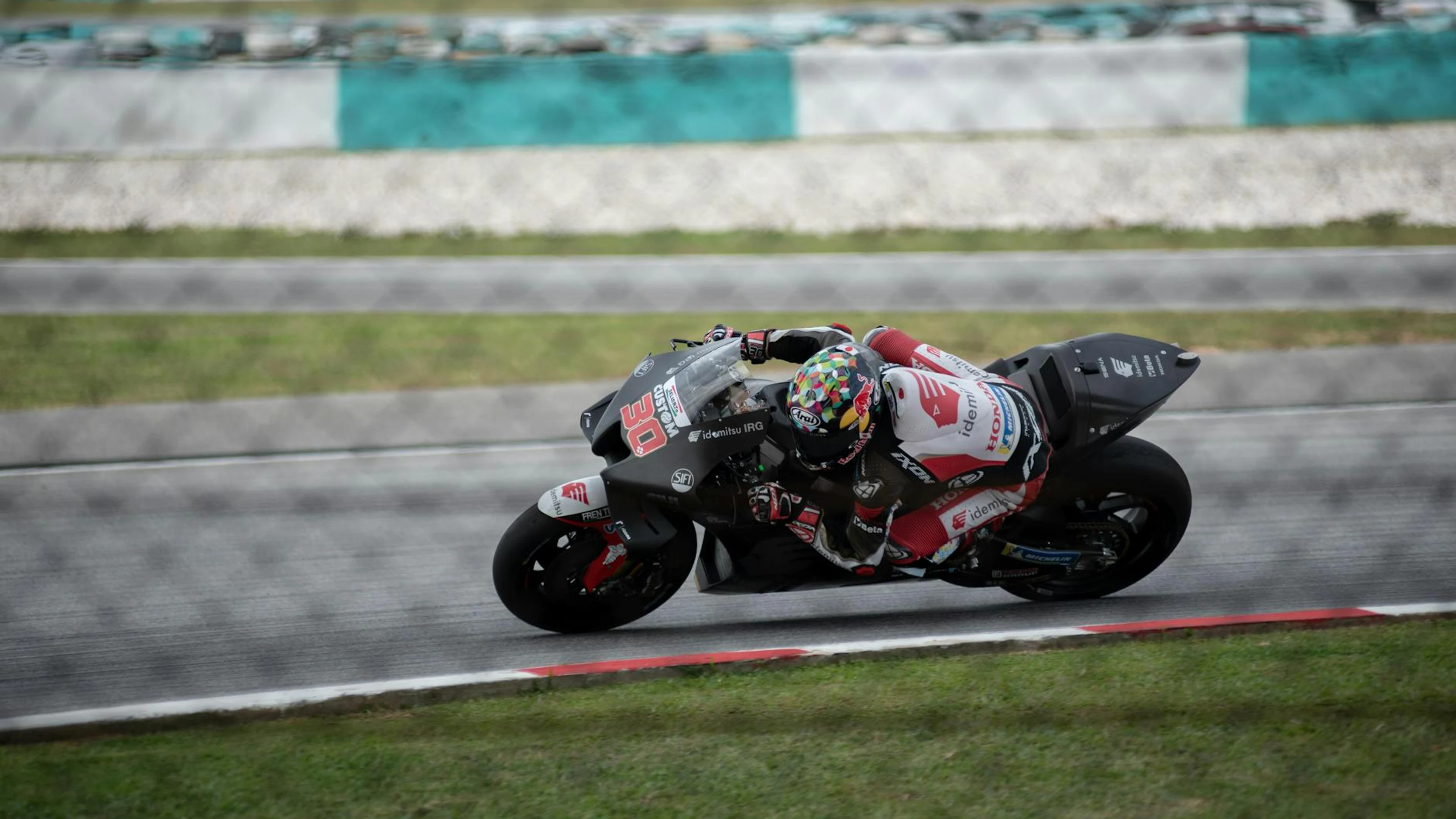 Exciting motorcycle race capturing high-speed action on a professional race trac - free 4K Ultra HD motorcycle wallpaper for desktop