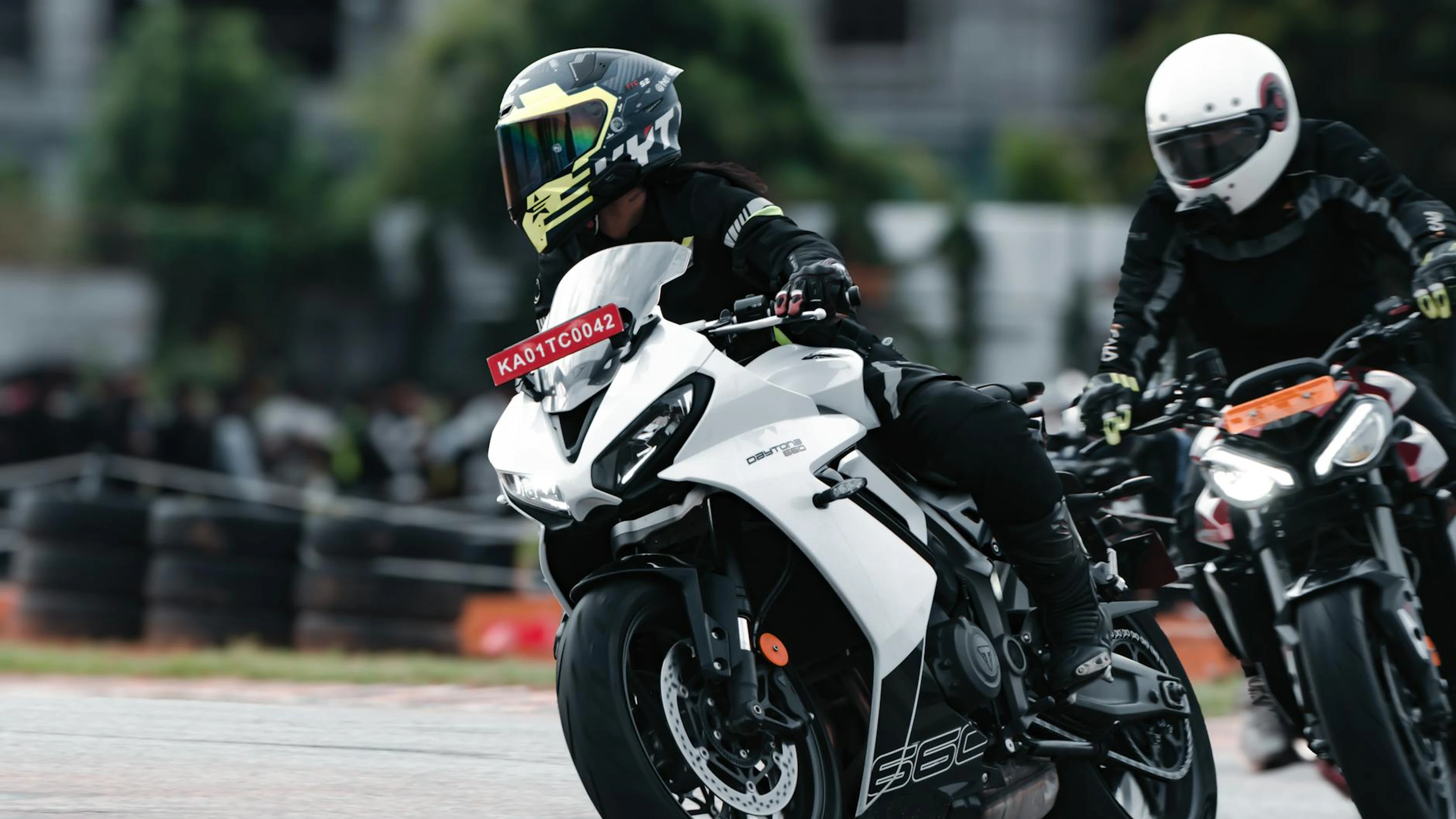 Exciting motorcycle race on a dirt track in Bengaluru, India featuring skilled r - free 4K Ultra HD motorcycle wallpaper for desktop