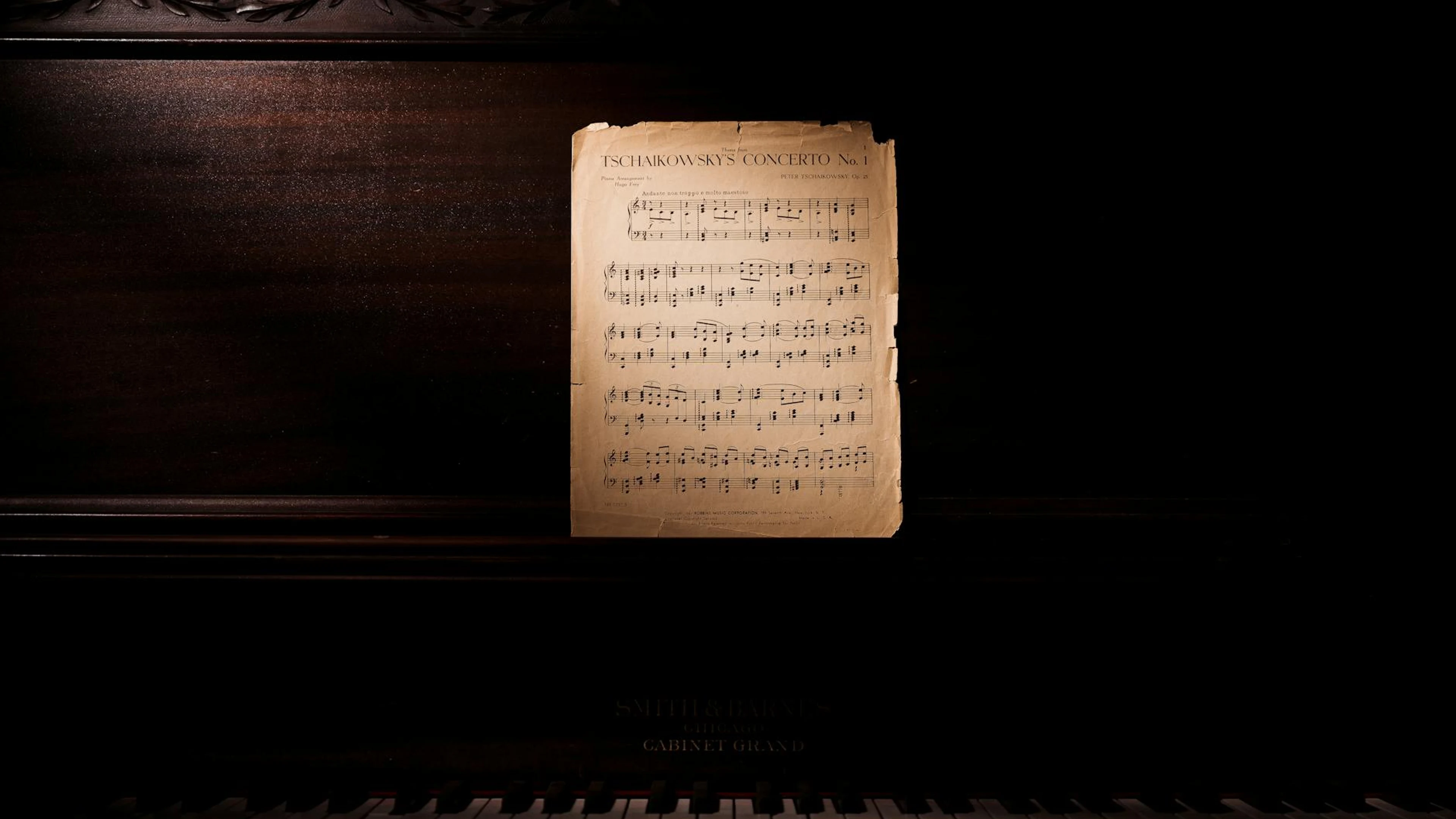 A classic piano with Tchaikovsky's concerto sheet music, evoking a nostalgic, mu - free 4K Ultra HD music wallpaper for desktop