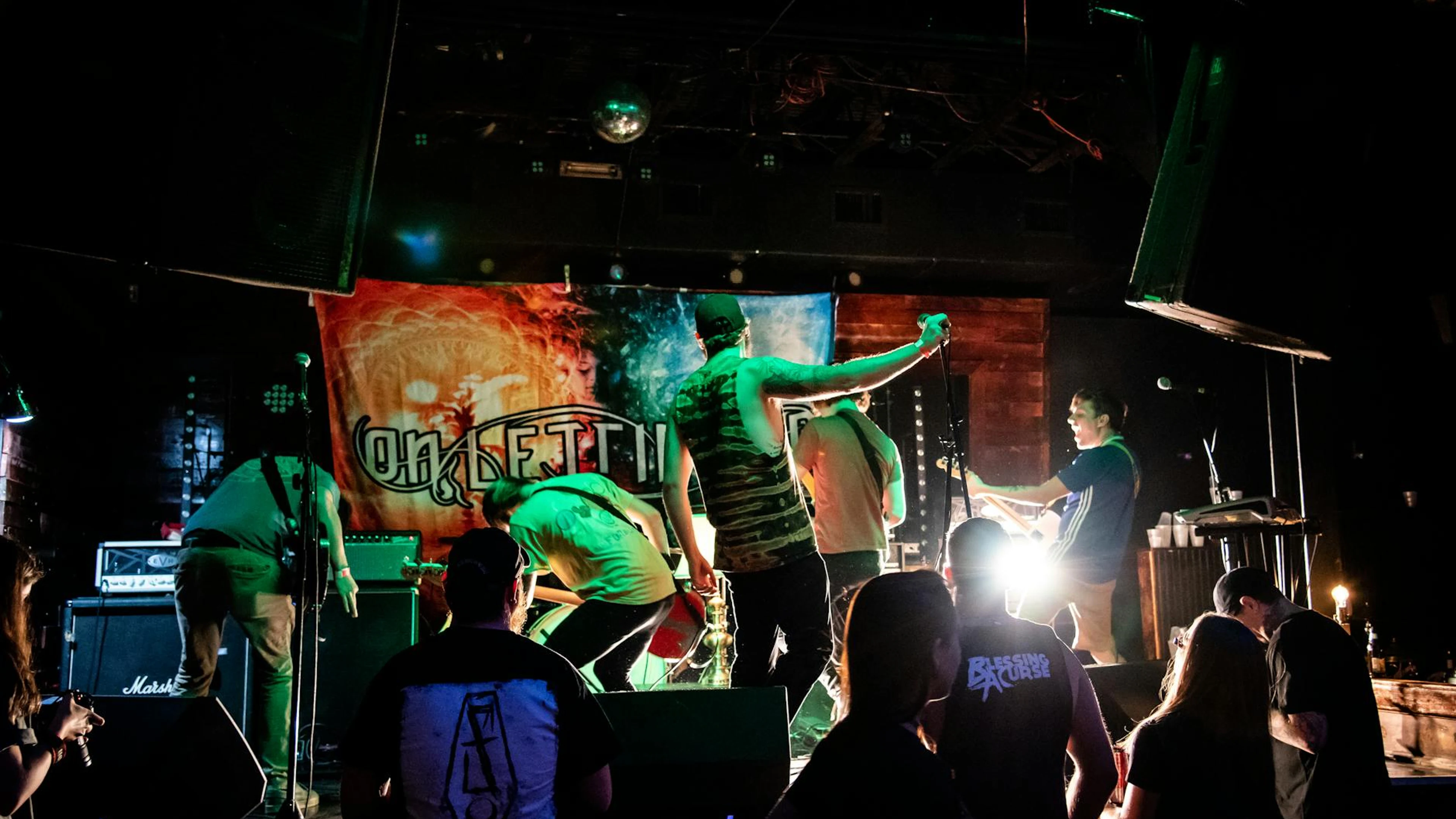 Energetic band performance on stage with vibrant lights and audience interaction - free 4K Ultra HD music wallpaper for desktop