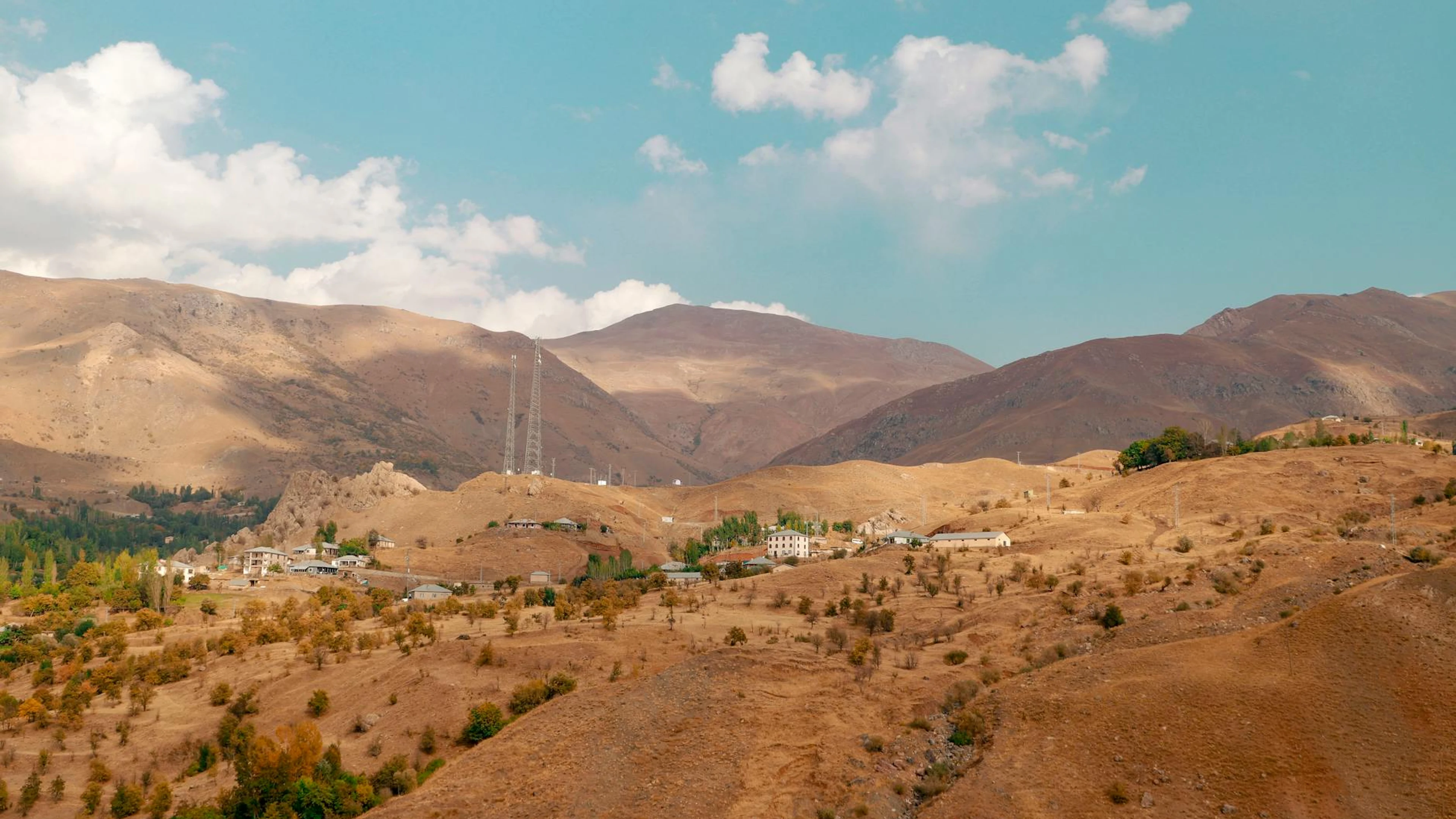 Beautiful arid landscape of Hakkâri, Türkiye, showcasing mountains and a small t - free 4K Ultra HD nature wallpaper for desktop