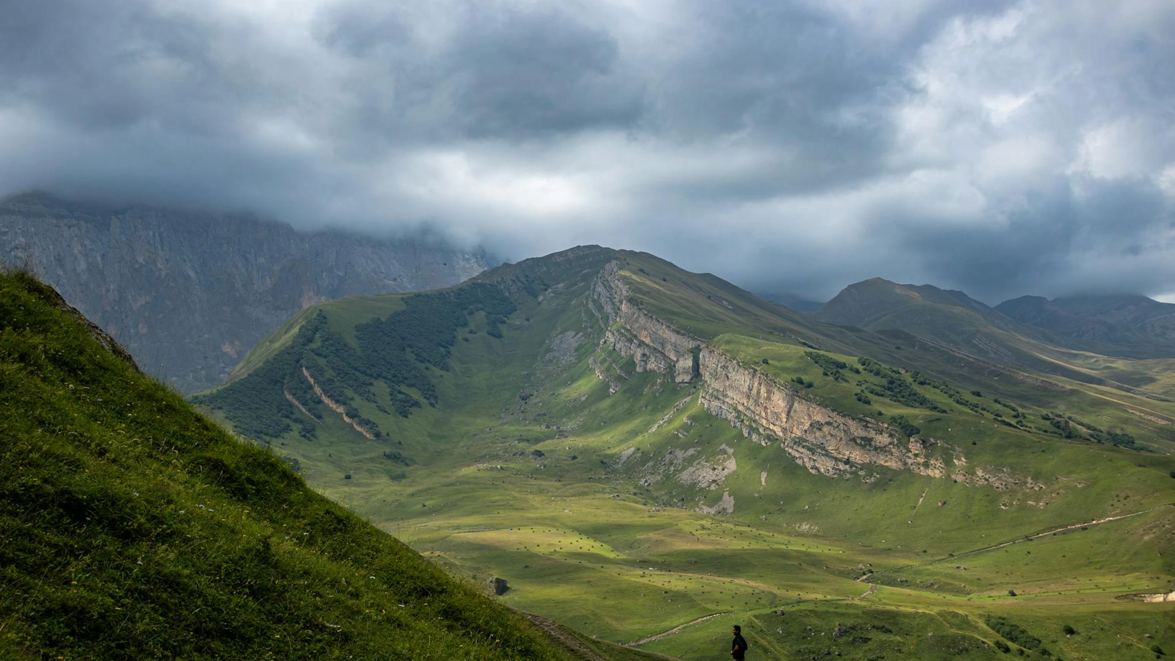 Breathtaking view of rolling green hills and cloudy sky in Qusar, Azerbaijan. - free 4K Ultra HD nature wallpaper for desktop
