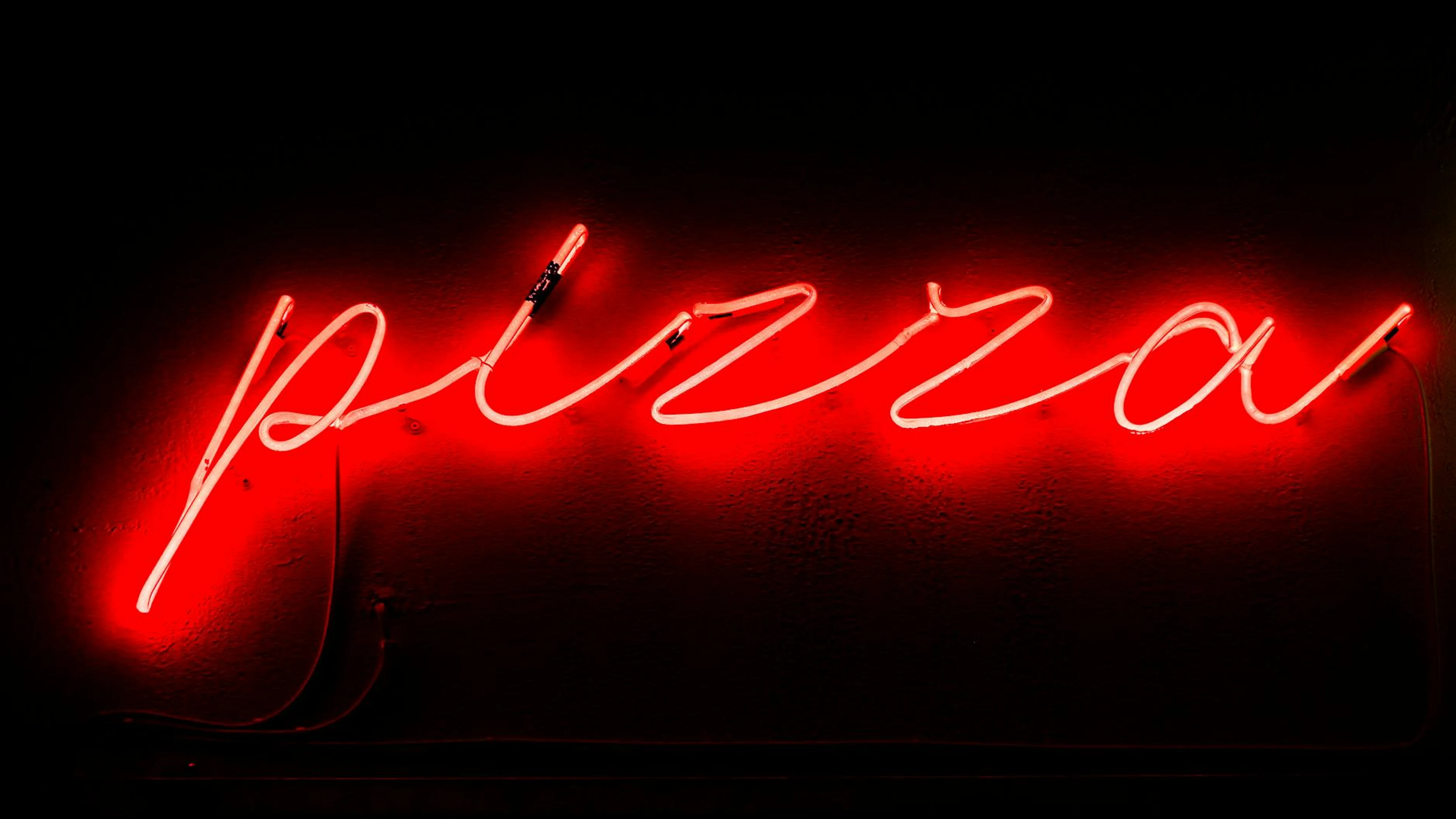 Bright red neon sign spelling 'pizza' captured at night in Athens, Greece. - free 4K Ultra HD neon wallpaper for desktop