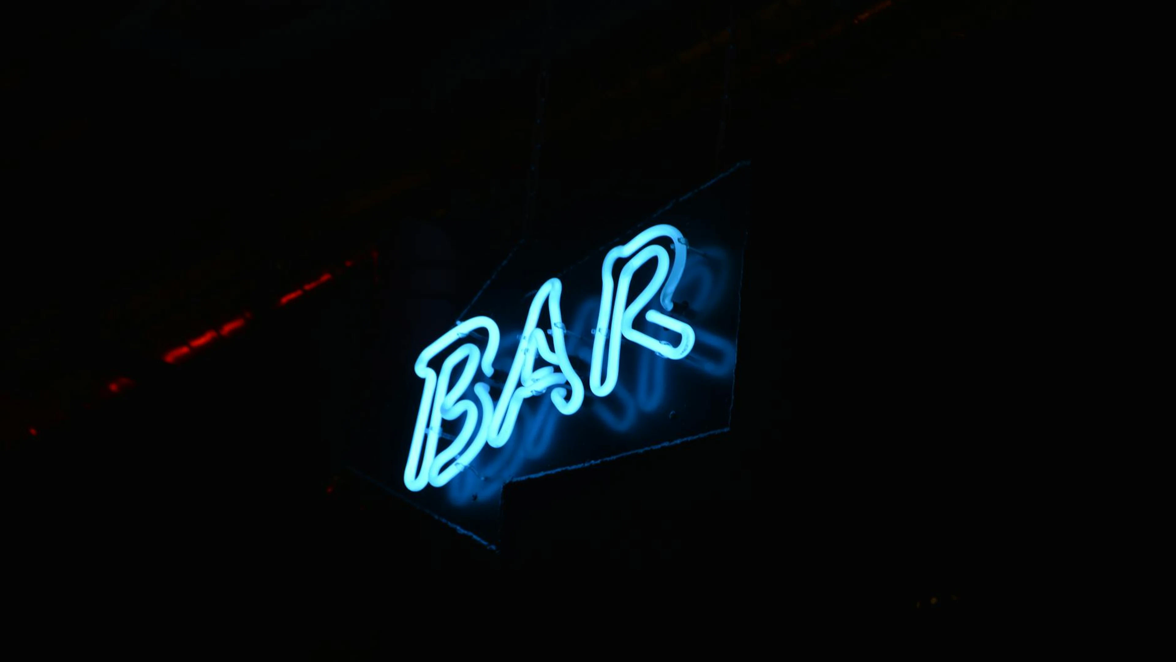 Glowing blue neon bar sign against a dark background, perfect for nightlife them - free 4K Ultra HD neon wallpaper for desktop