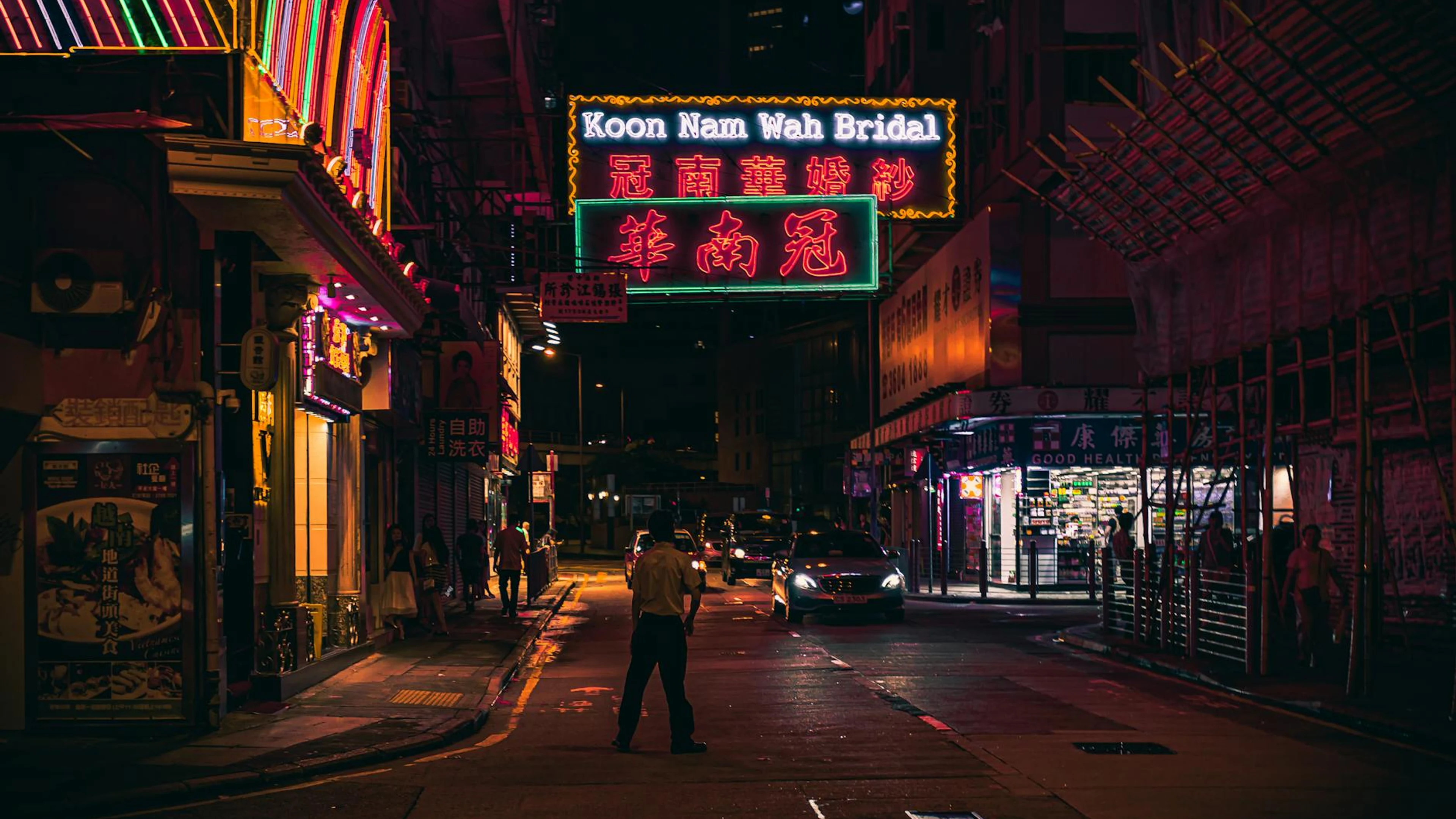 Neon-lit street view in Hong Kong at night showcasing bustling urban life. - free 4K Ultra HD neon wallpaper for desktop