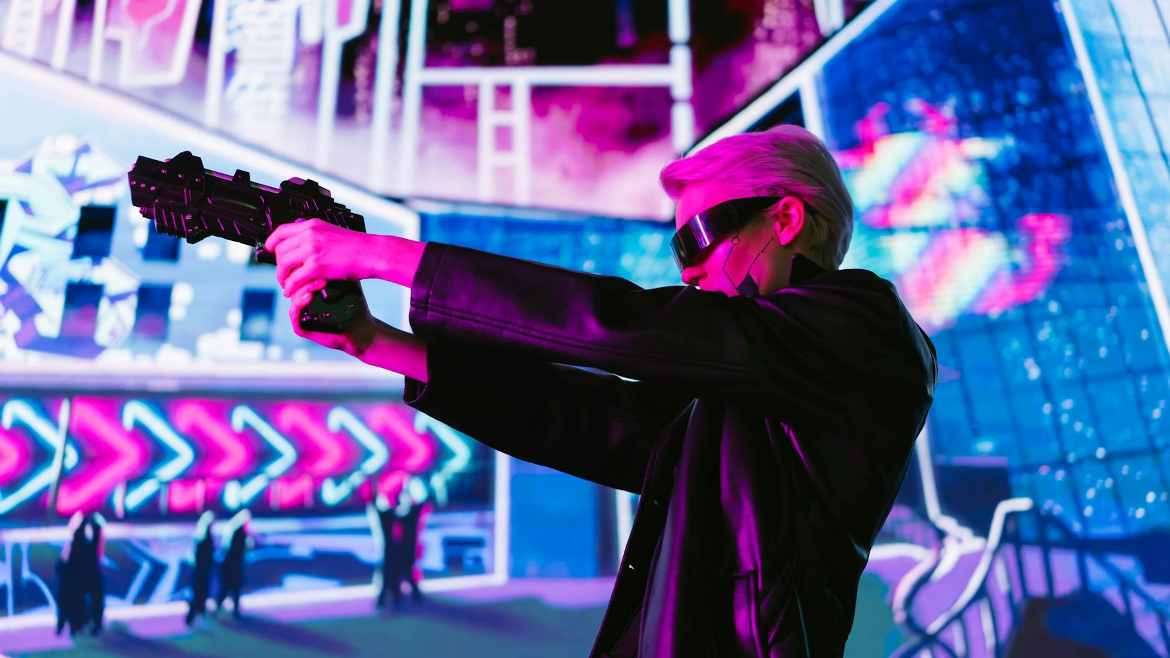Person in cyberpunk attire aims futuristic gun in neon-lit scene - free 4K Ultra HD neon wallpaper for desktop