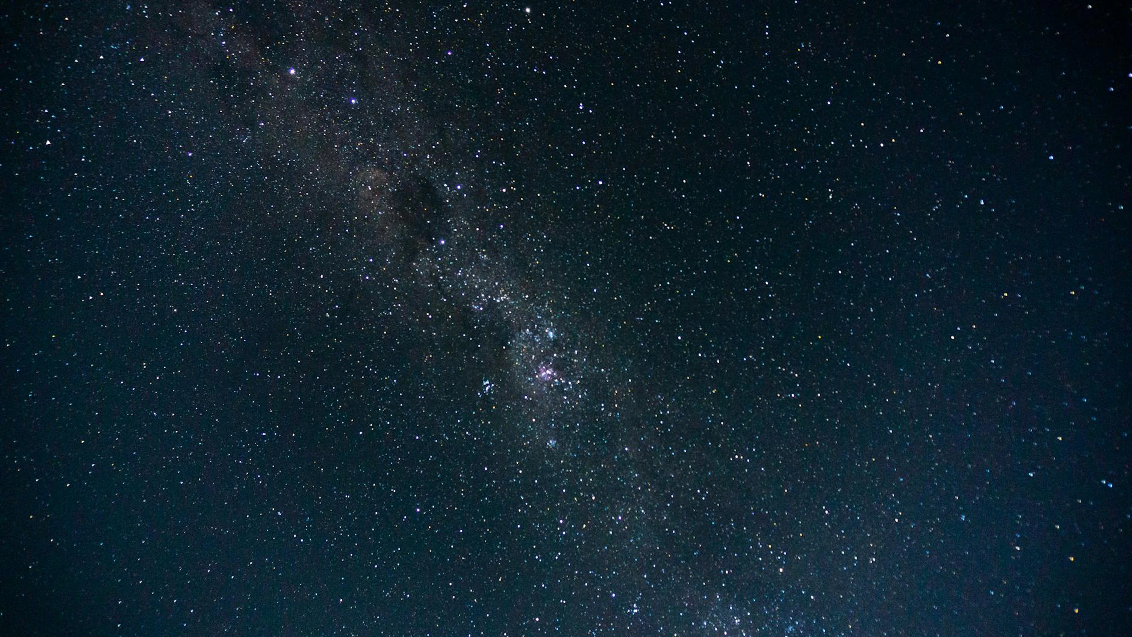 A breathtaking capture of the Milky Way galaxy showcasing a star-filled night sk - free 4K Ultra HD space wallpaper for desktop