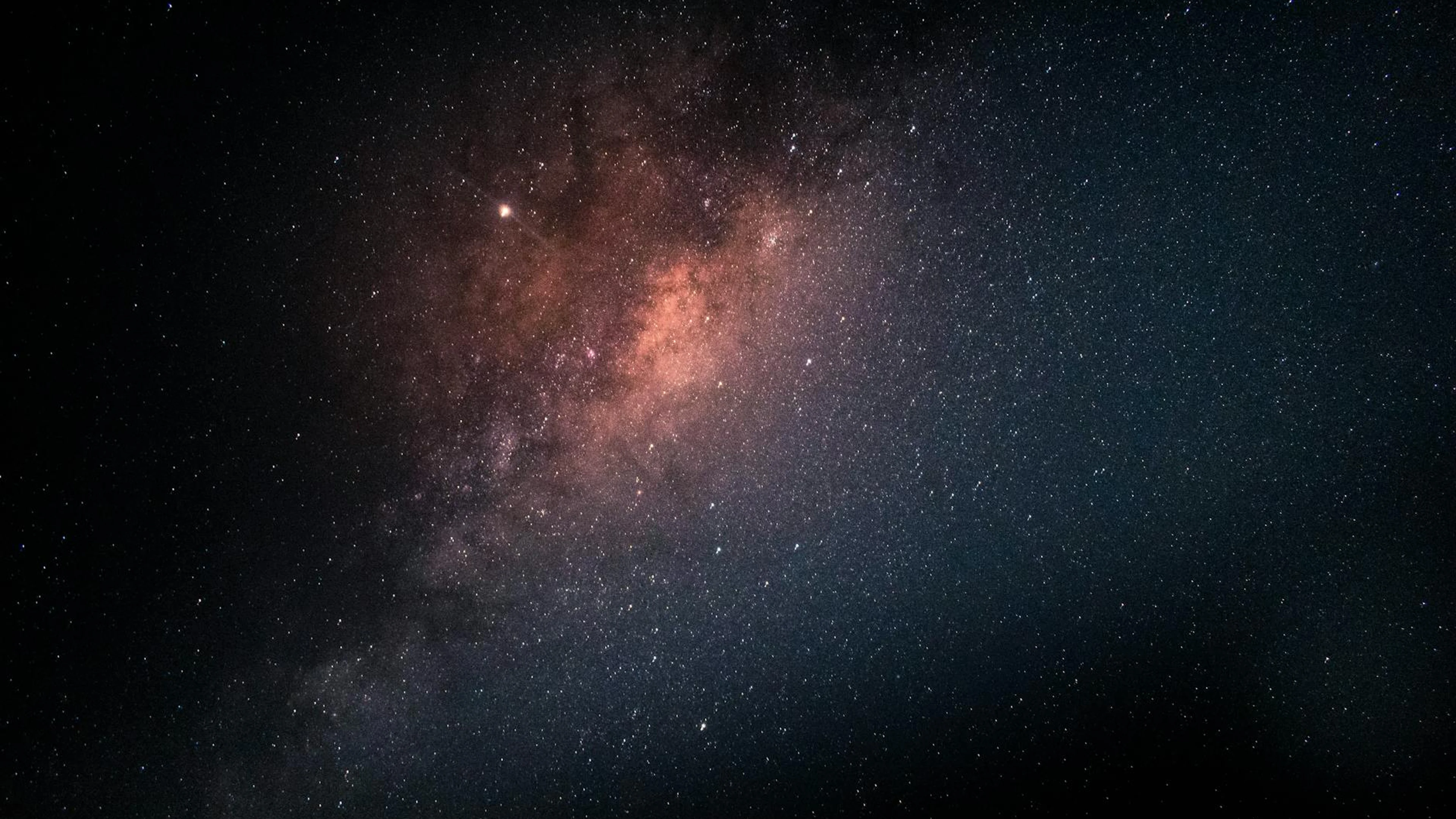 A breathtaking view of the Milky Way galaxy captured during a clear night sky. - free 4K Ultra HD space wallpaper for desktop