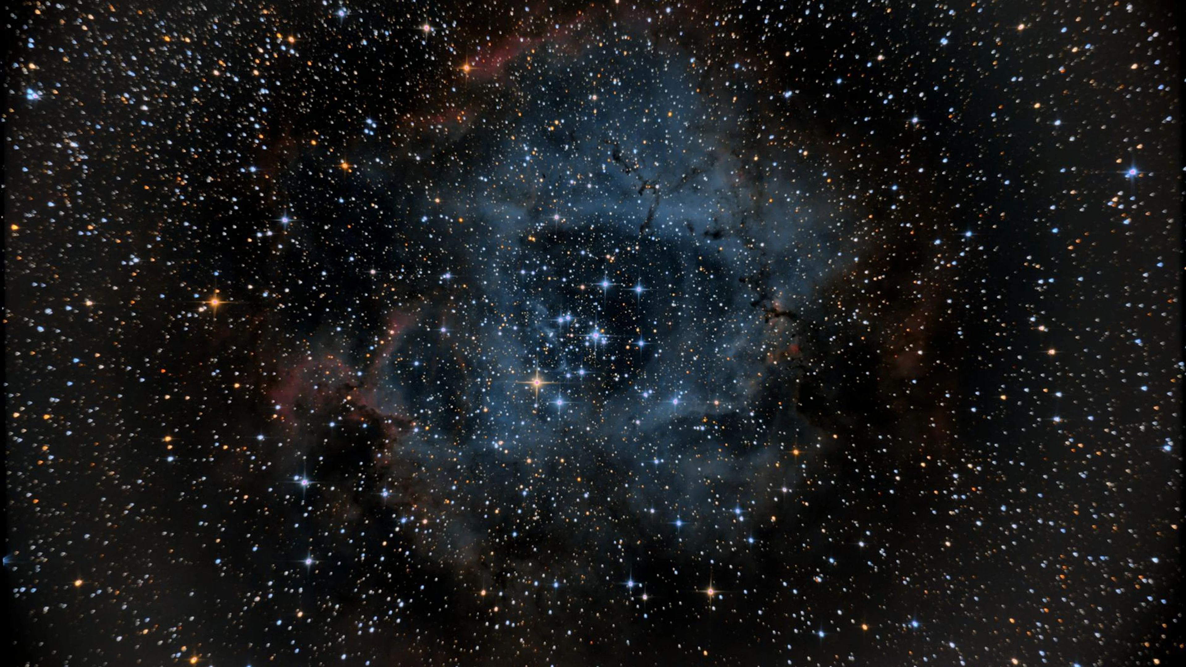 A breathtaking view of the Rosette Nebula surrounded by stars in deep space, sho - free 4K Ultra HD space wallpaper for desktop