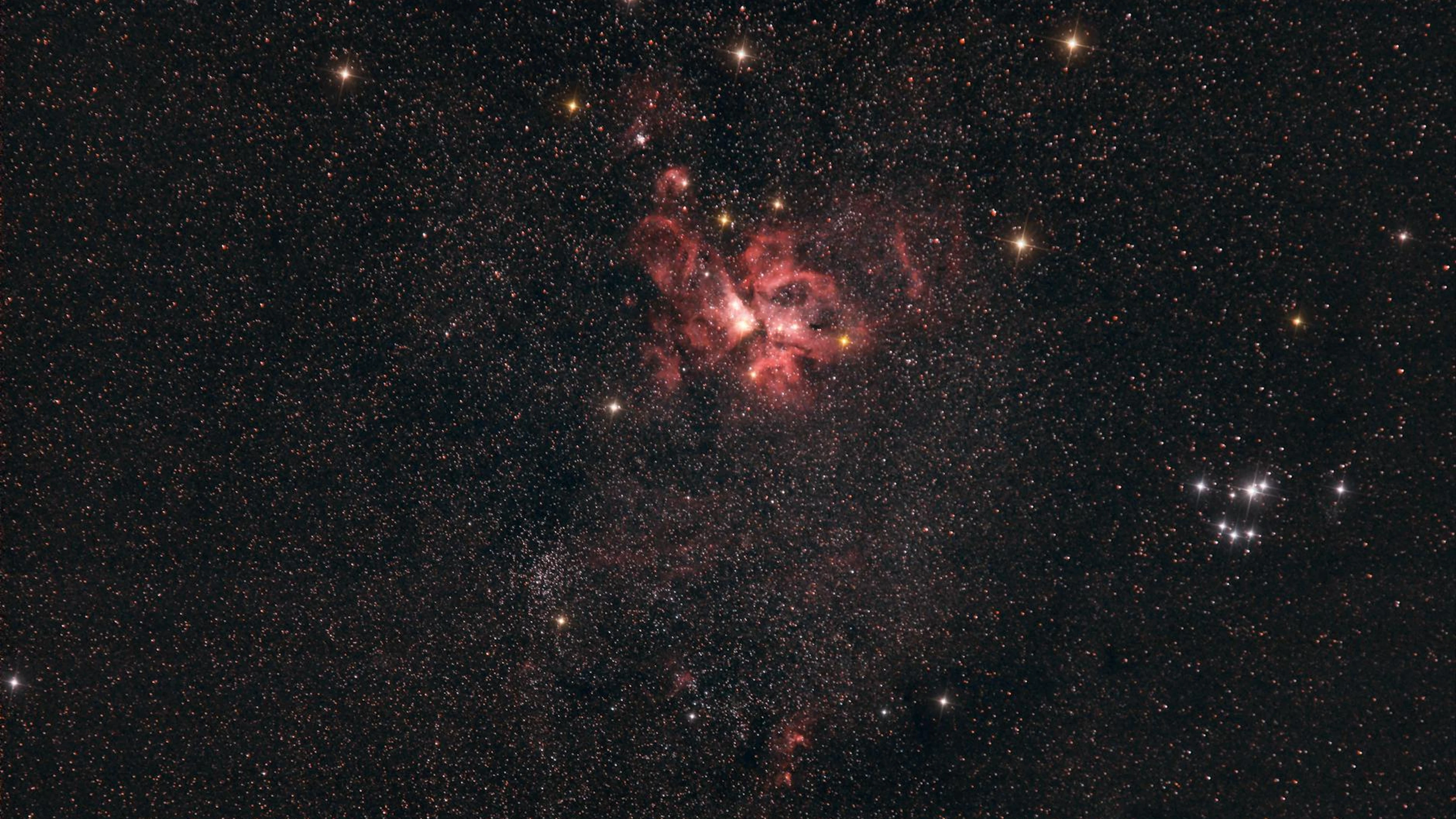 Beautiful high-resolution image of the Rosette Nebula surrounded by stars in dee - free 4K Ultra HD space wallpaper for desktop