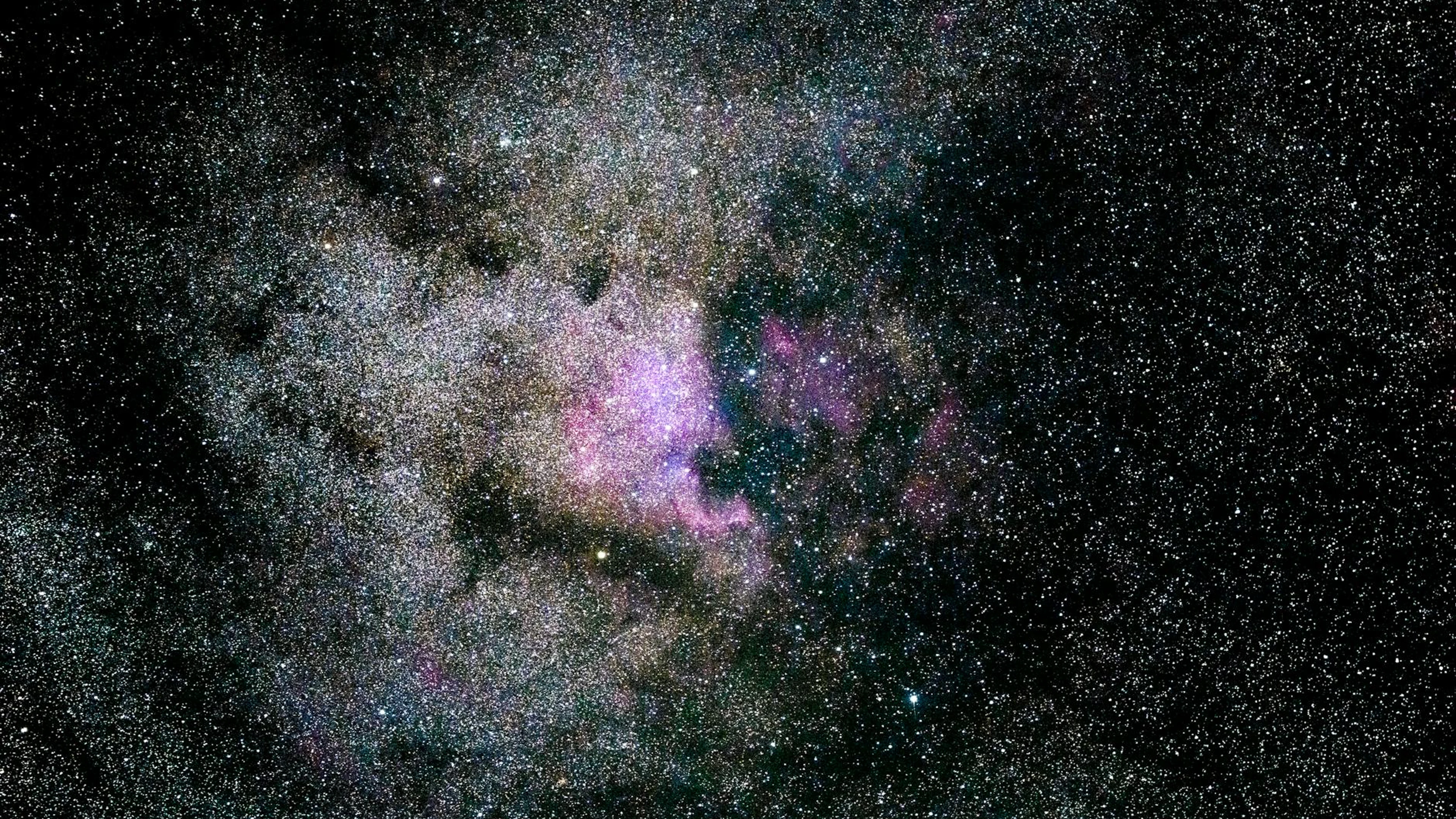 Captivating image of a vibrant nebula filled with stars in the expansive univers - free 4K Ultra HD space wallpaper for desktop