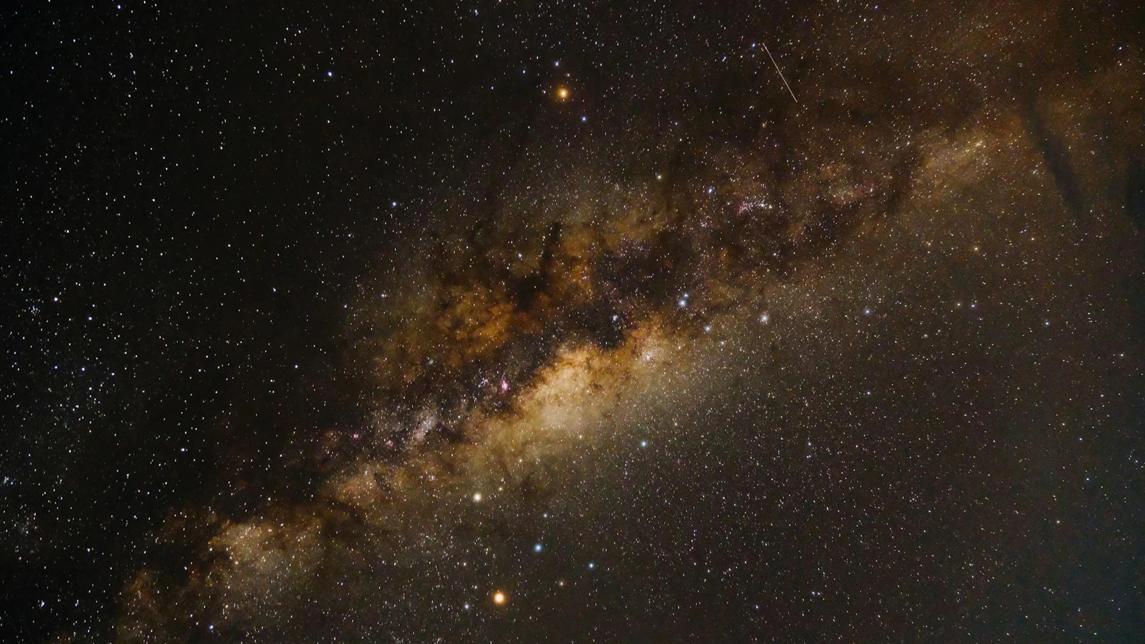 Captivating photograph of the Milky Way galaxy displaying vivid stars and inters - free 4K Ultra HD space wallpaper for desktop