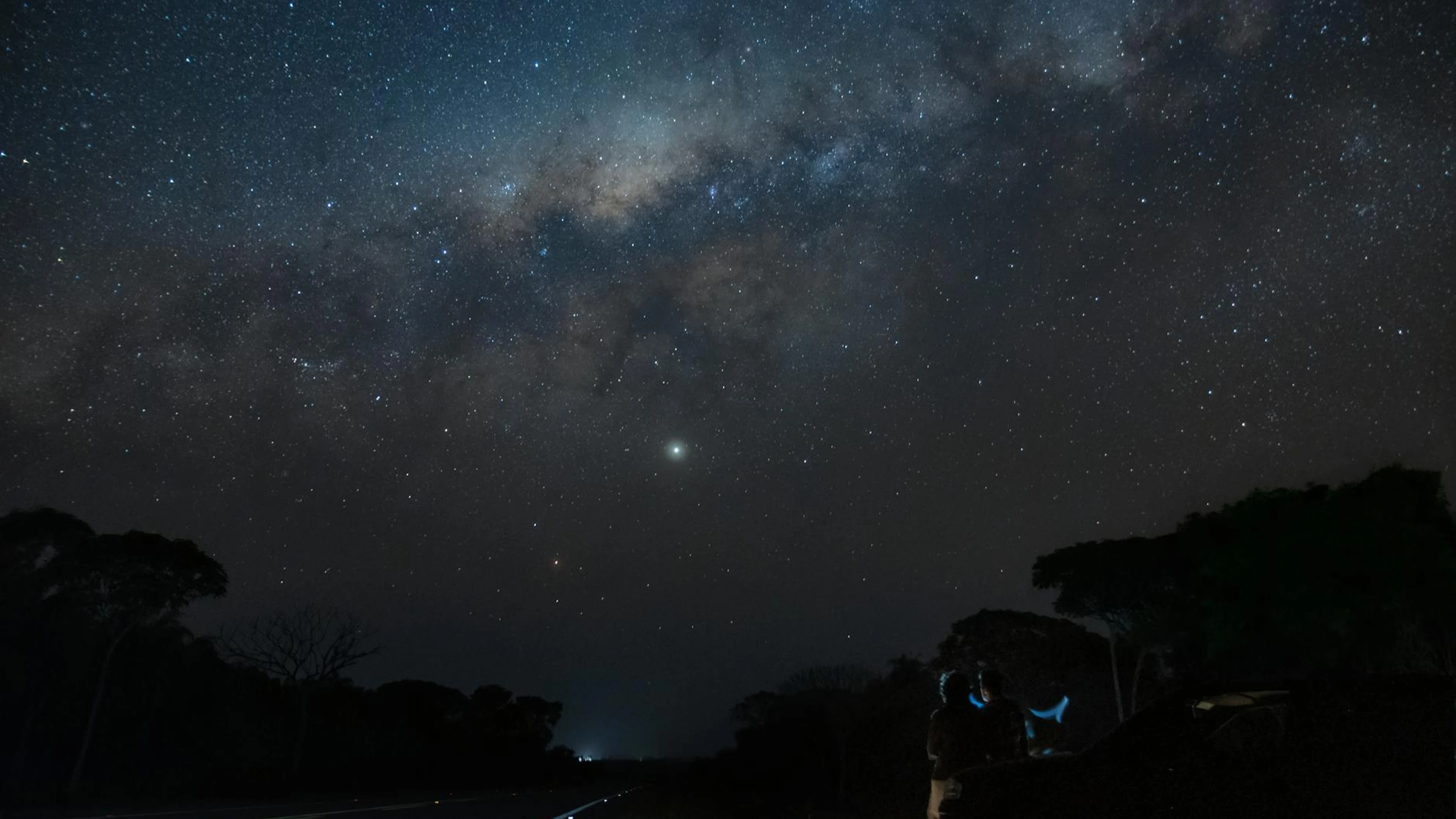 Captivating view of the Milky Way over a peaceful road in Bonito, Brazil. Perfec - free 4K Ultra HD space wallpaper for desktop