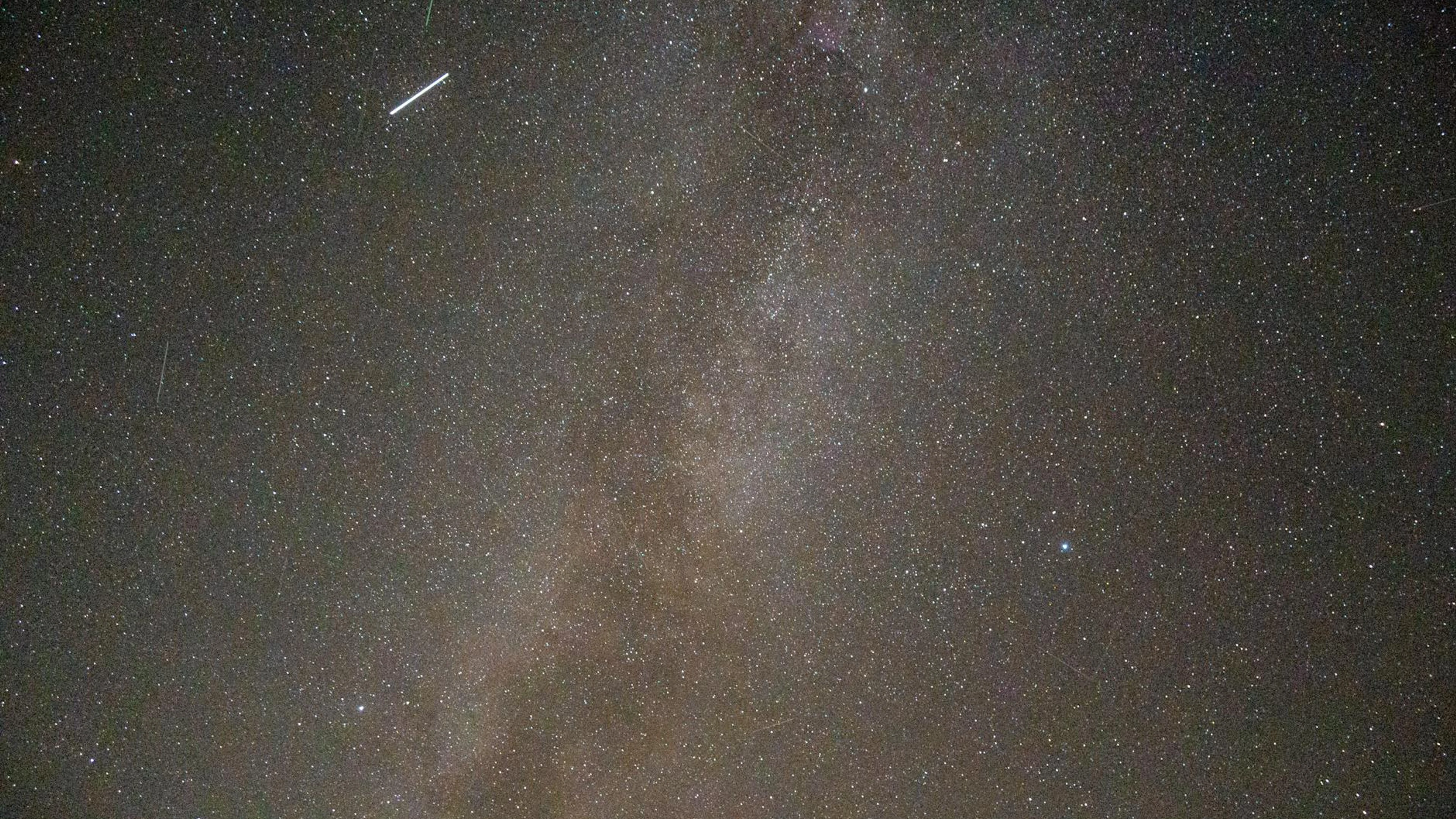 Capture the breathtaking beauty of the Milky Way galaxy with this starry night v - free 4K Ultra HD space wallpaper for desktop