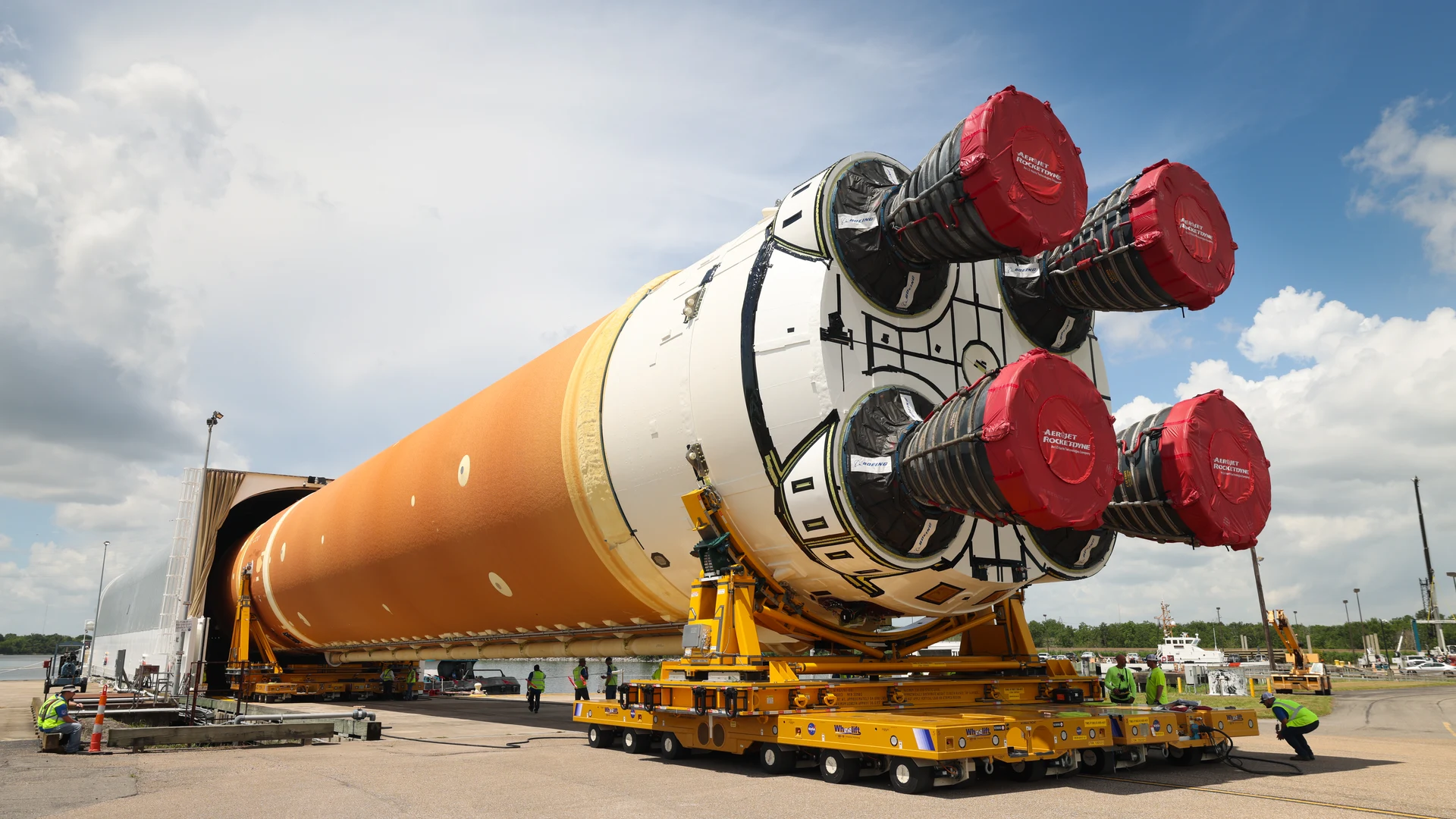 Space Launch System Core Stage for Artemis II Rocket Loaded onto Pegasus Barge - free hd space wallpaper for desktop