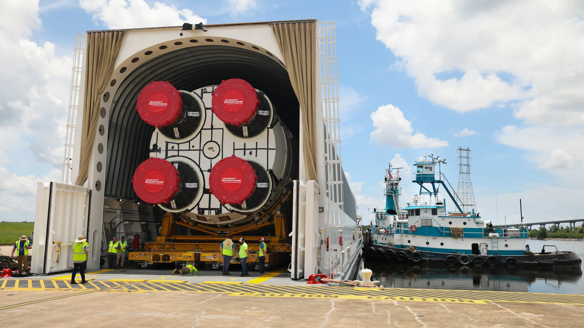 Space Launch System Core Stage for Artemis II Rocket Loaded onto Pegasus Barge   - free hd space wallpaper for desktop