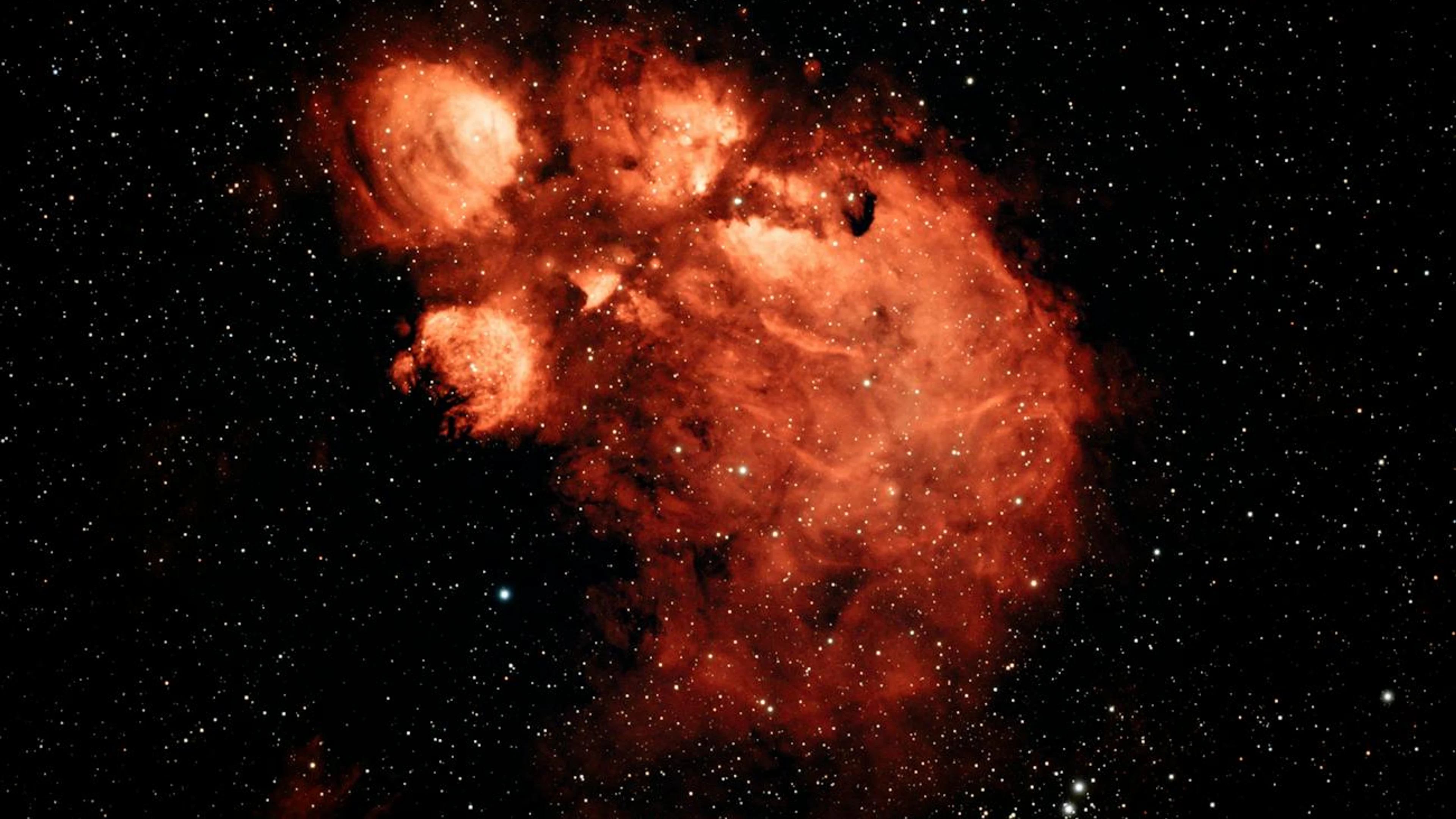 Vivid red nebula captured in vast starry sky, showcasing cosmic beauty. - free 4K Ultra HD space wallpaper for desktop