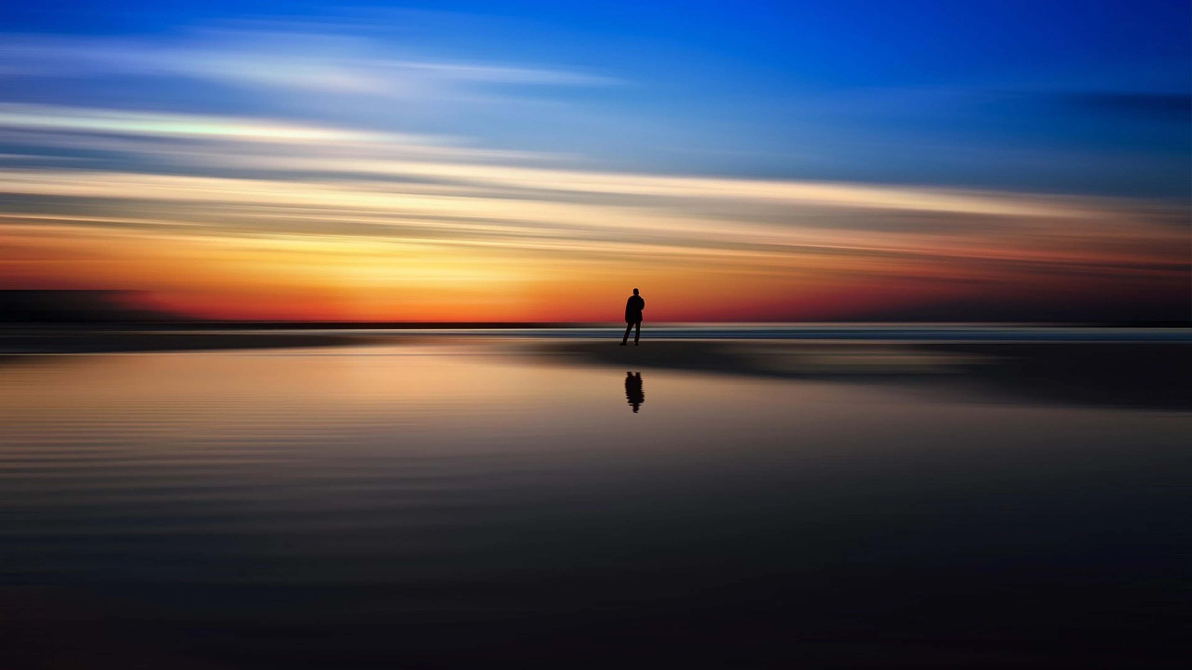 Beach person silhouette - free 4K Ultra HD sunset wallpaper for desktop