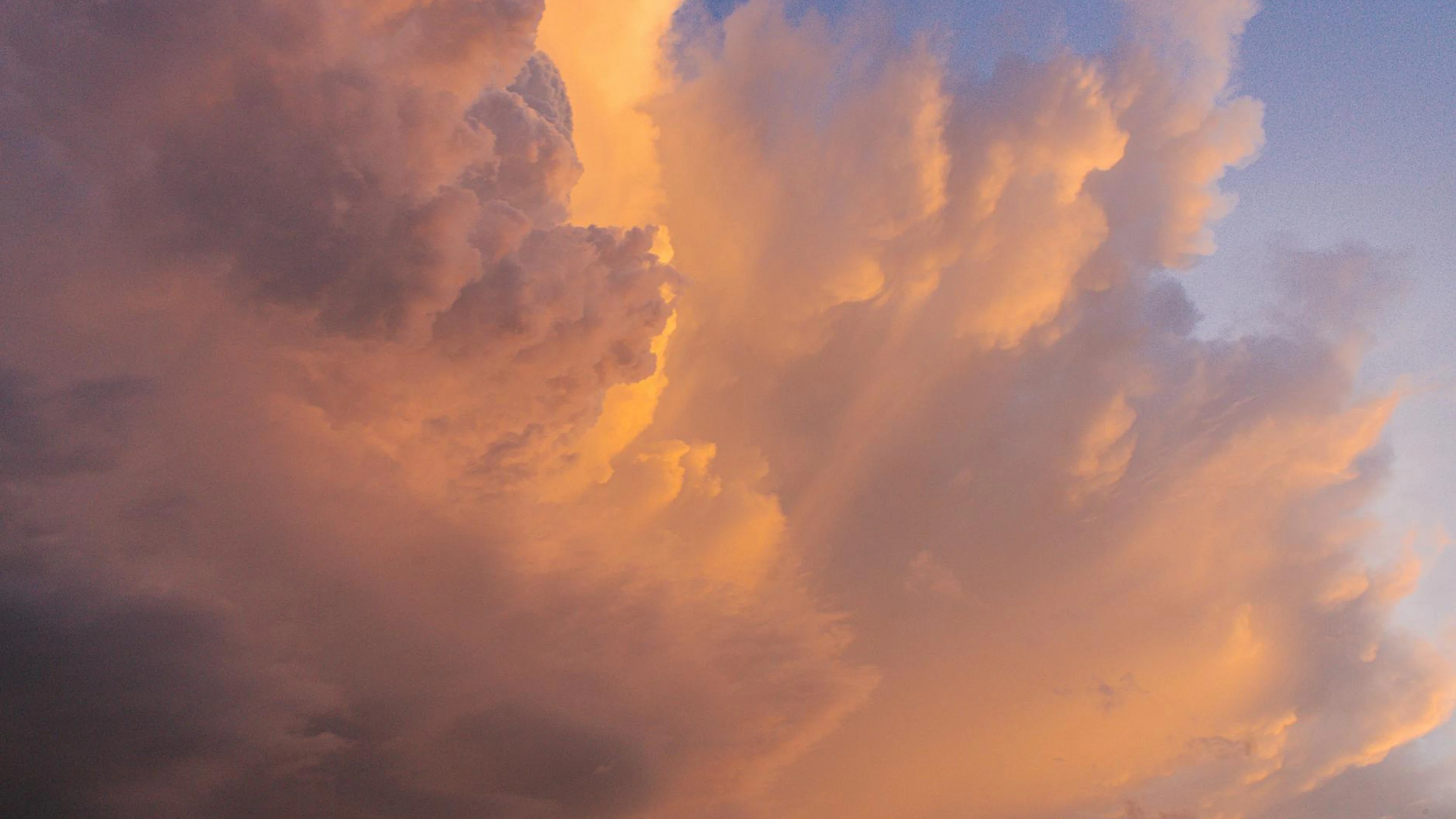 Captivating sky with dramatic clouds at sunset, showcasing soft pastel hues. - free 4K Ultra HD sunset wallpaper for desktop